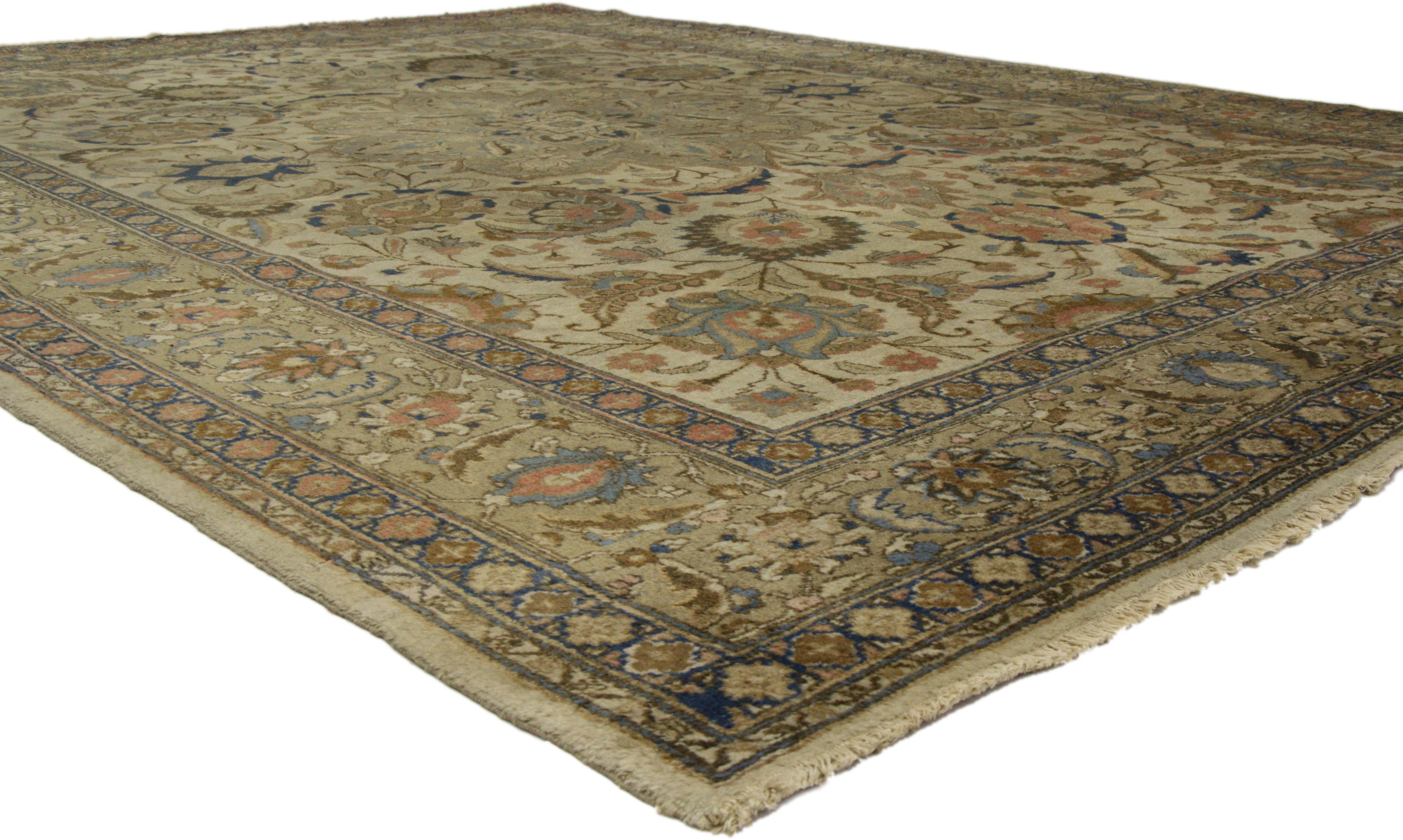 73338 Distressed Antique Persian Tabriz Area Rug with Traditional Style. Embodying the highly decorative aesthetic and neutral color palette sought by many, this breathtaking distressed hand-knotted wool antique Persian Tabriz rug highlights a