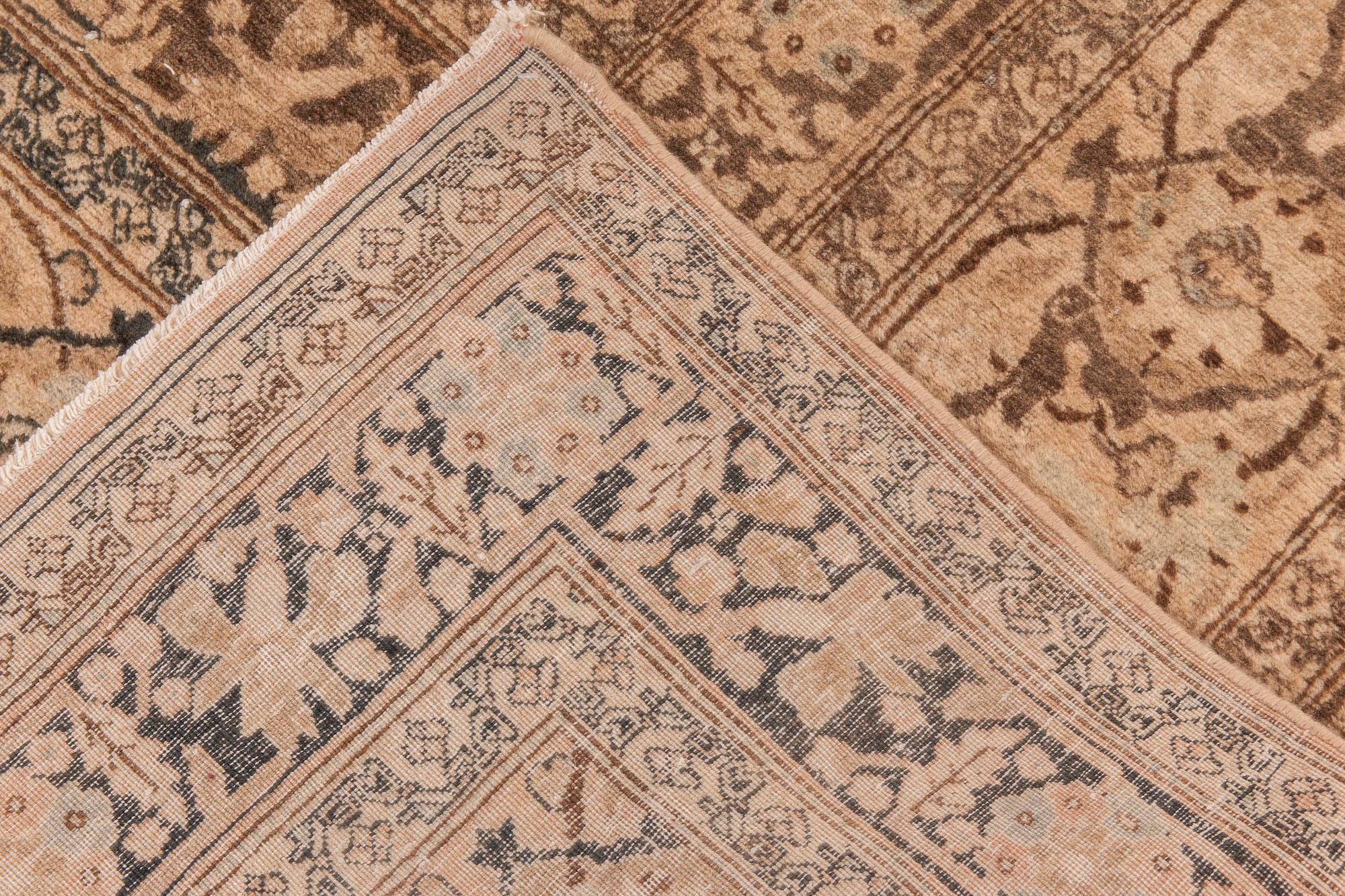 20th Century Antique Persian Tabriz Handwoven Wool Carpet For Sale