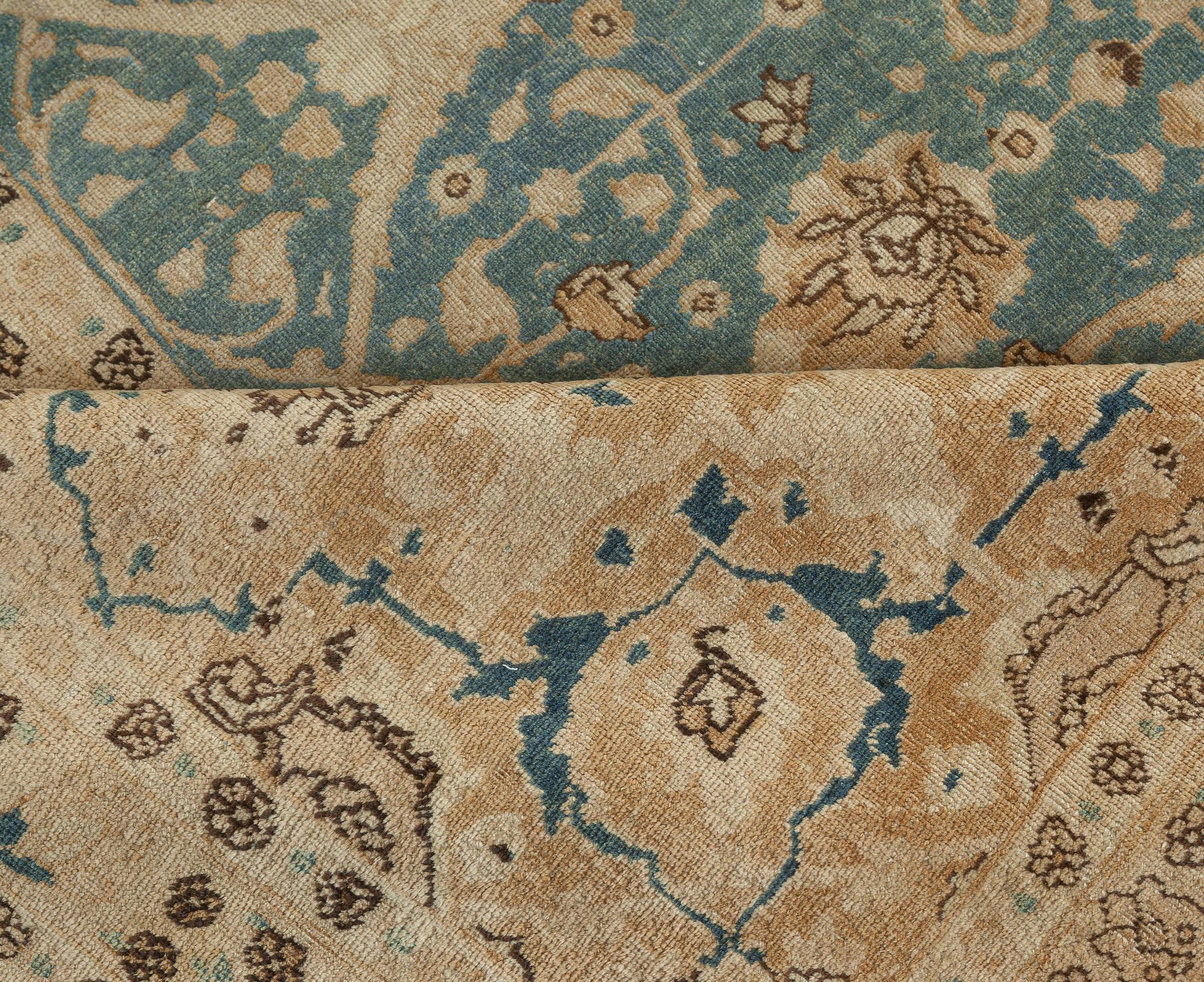 Antique Persian Tabriz handmade wool carpet.
Size: 11'2