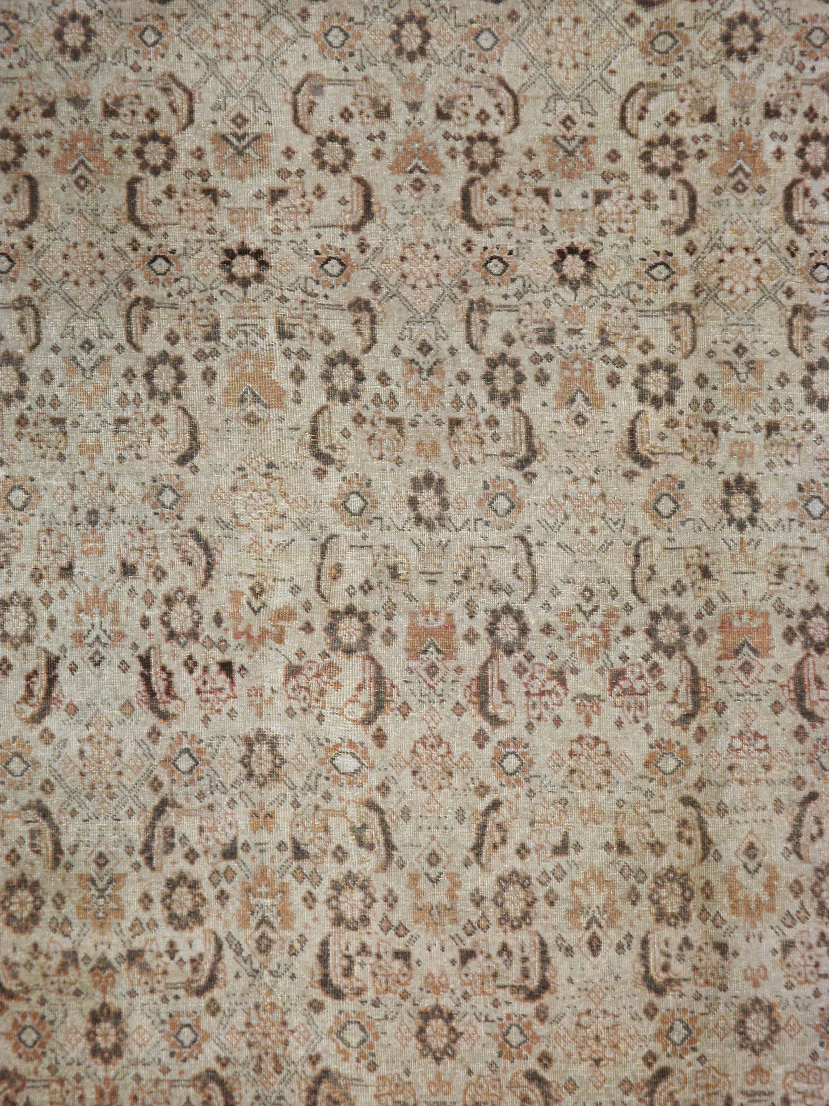 An antique Persian Tabriz carpet from the early 20th century.