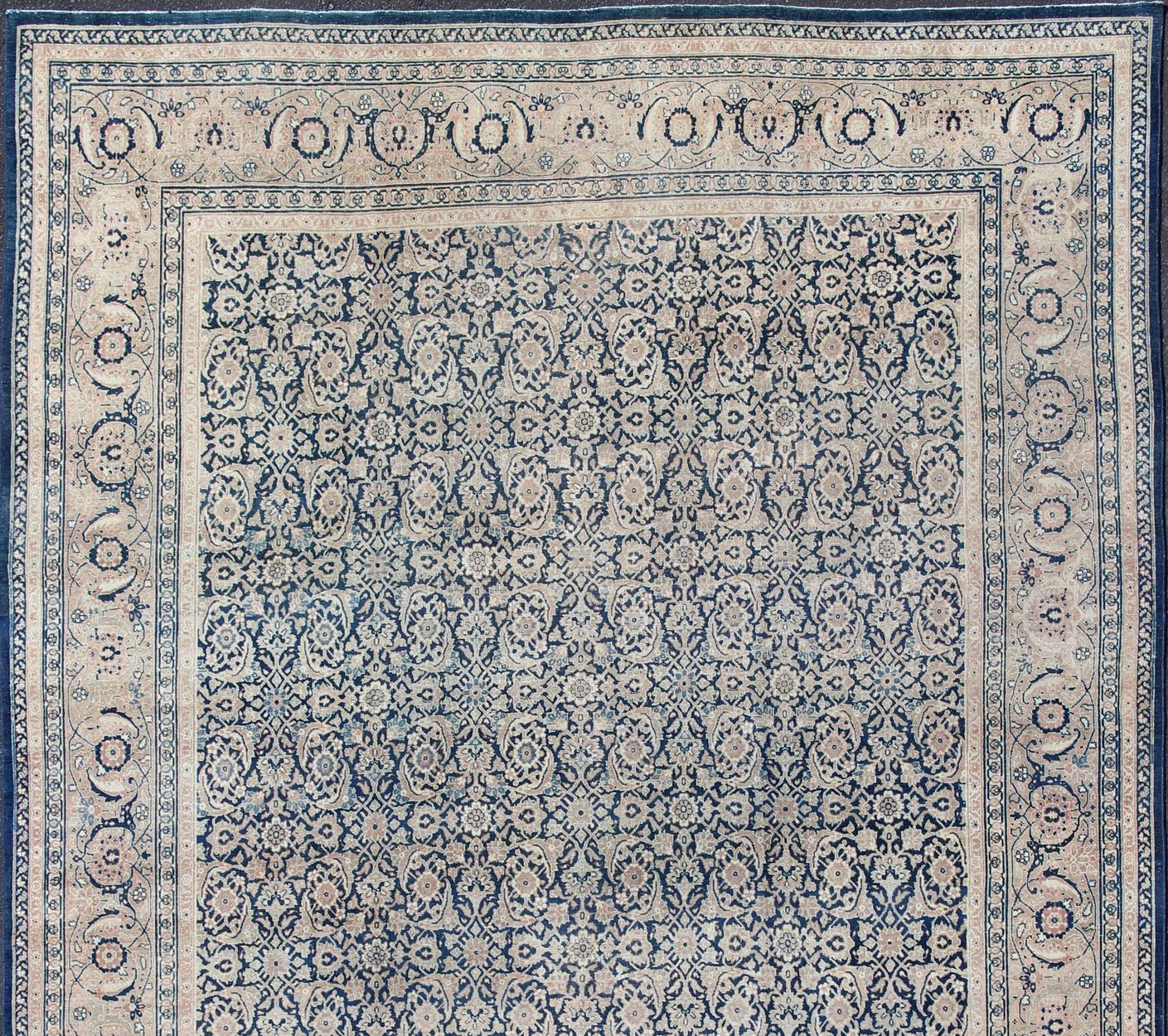 Antique Persian Tabriz carpet with geometric Herati design in dark blue tones. Dark blue, Navy blue, gray, taupe, tan and brown geometric Persian Tabriz rug. Keivan Woven Arts / rug 19-0404, country of origin / type: Iran / Tabriz, circa