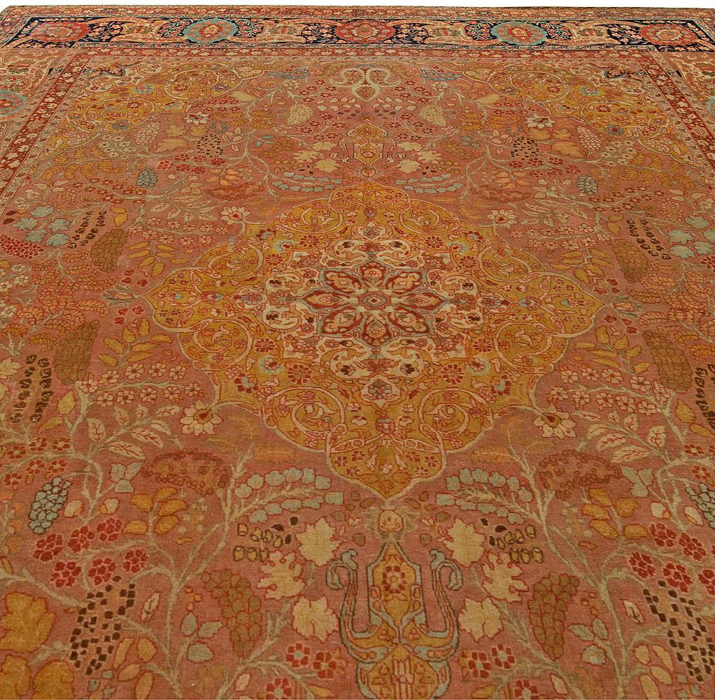 Antique Persian Tabriz hand knotted wool rug
Size: 9'0