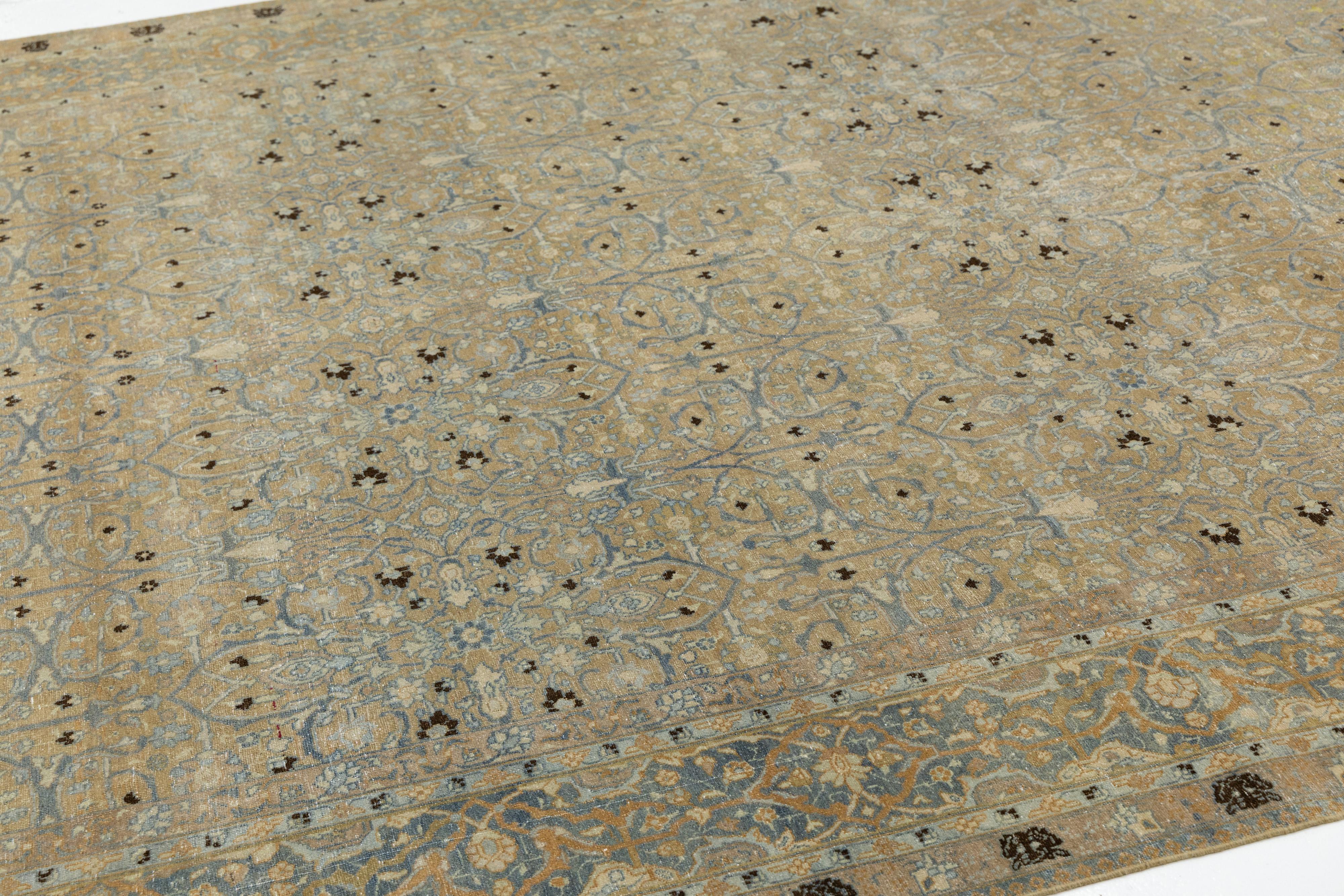 Antique Persian Tabriz Designed Wool Rug Floral in Muted Tones In Good Condition For Sale In Norwalk, CT