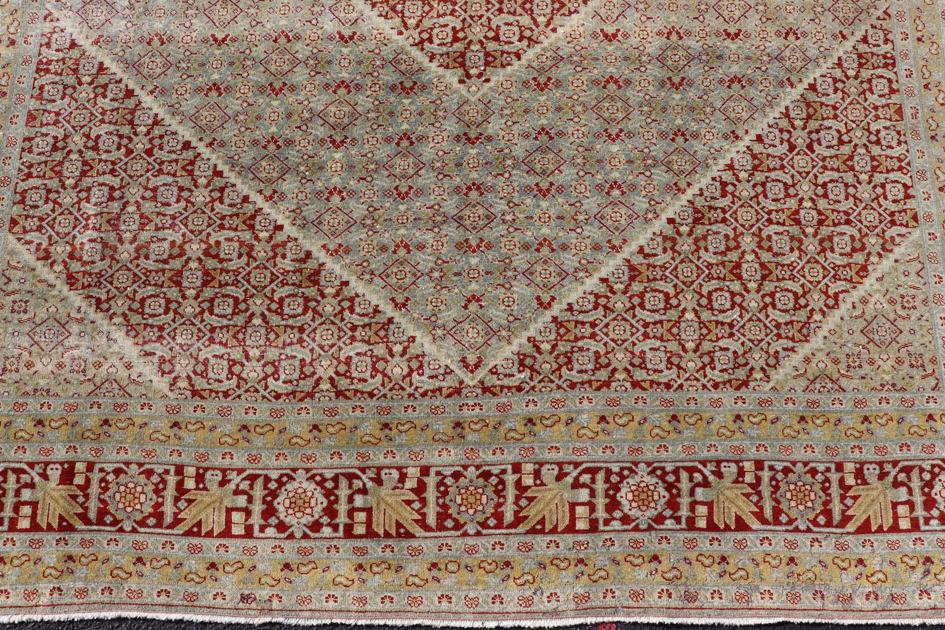 20th Century Antique Persian Tabriz Distressed Carpet with Geometric Diamond Design For Sale