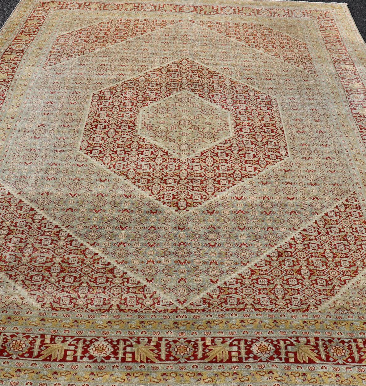 Wool Antique Persian Tabriz Distressed Carpet with Geometric Diamond Design For Sale