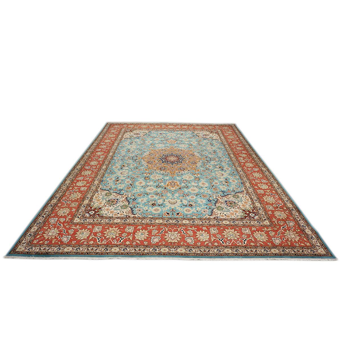 Ashly Fine Rugs presents a 1940s Antique Persian Tabriz. Tabriz is a northern city in modern-day Iran and has forever been famous for the fineness and craftsmanship of its handmade rugs. This piece has a beautiful light blue and ivory background