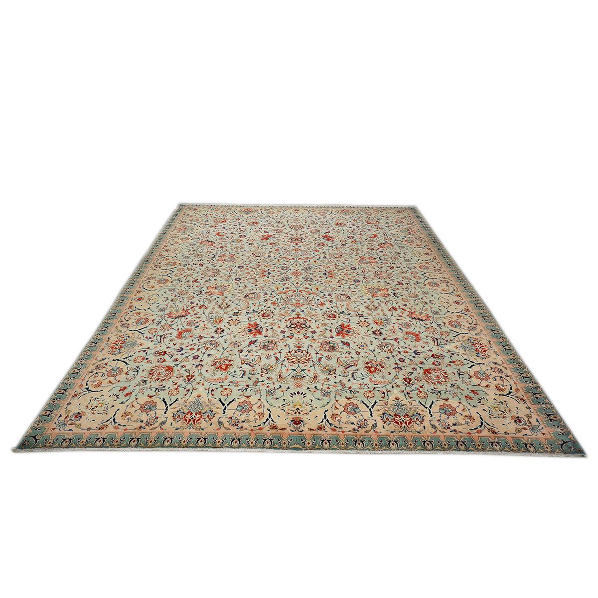 Ashly Fine Rugs presents a Persian Tabriz Emad circa 1930-40, handwoven in Iran at the Emad workshop in Tabriz, one of the most sought-after carpets and well-known workshops. They were known to make rugs with this particular light blue and salmon