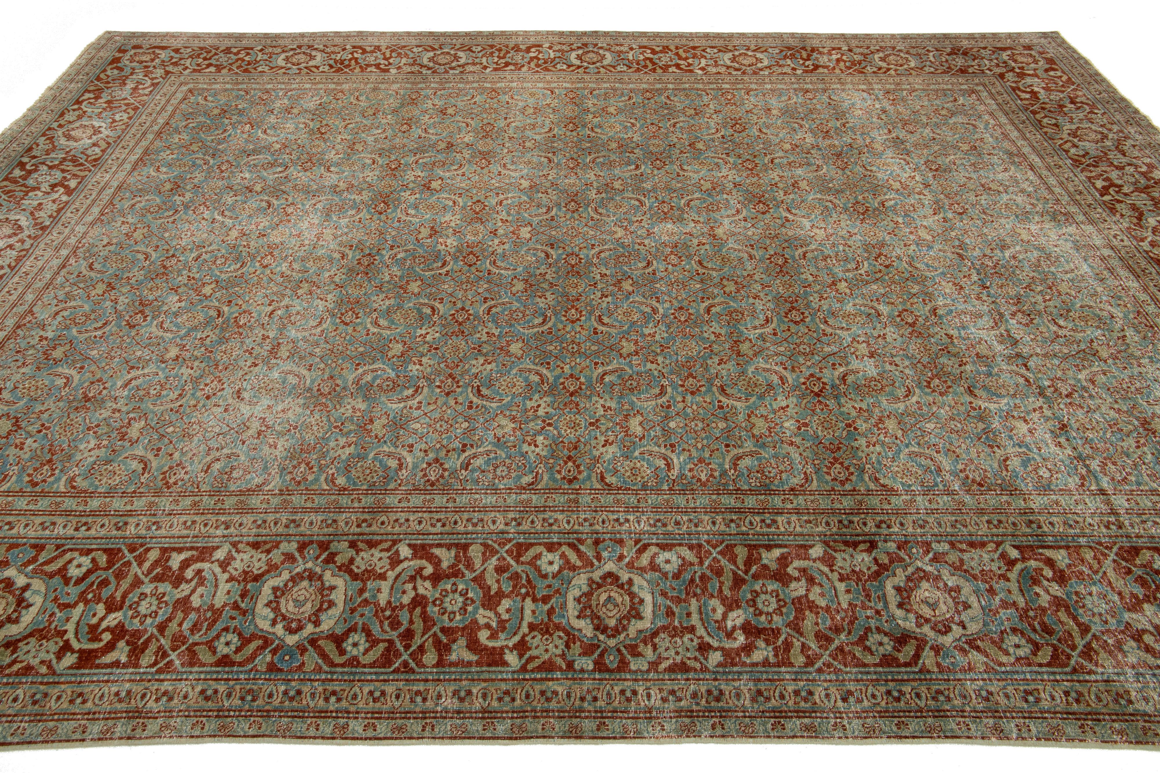 Antiker persischer Täbris-Wollteppich in Blau mit Blumenmuster (20. Jahrhundert) im Angebot