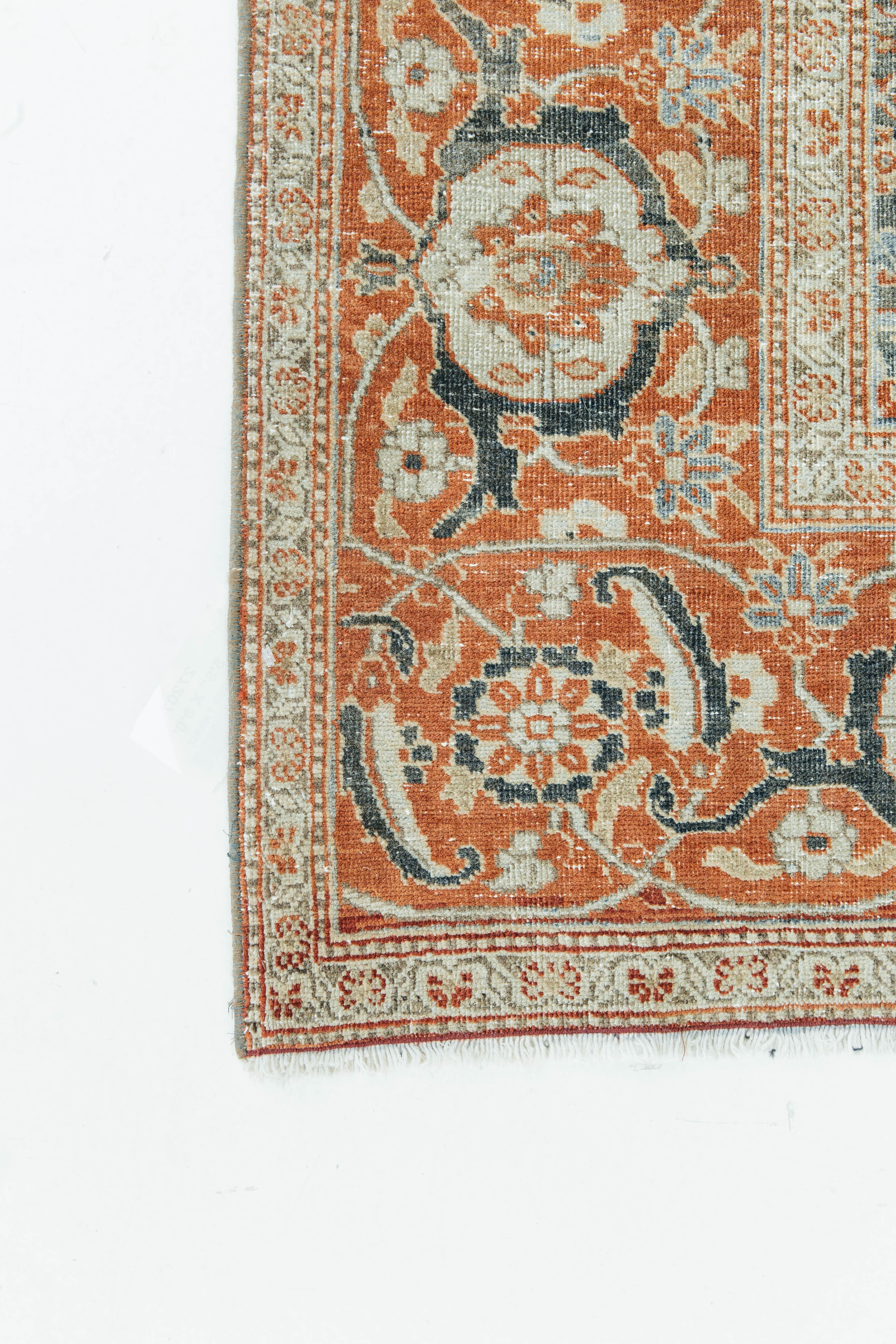 An antique Persian Tabriz embezzled with intricate medallions throughout the piece. Tribal Tabriz patterns bring an elegant touch to any setting due to their intricacy in design as well as their quality of wool. Luxurious colors of deep orange,