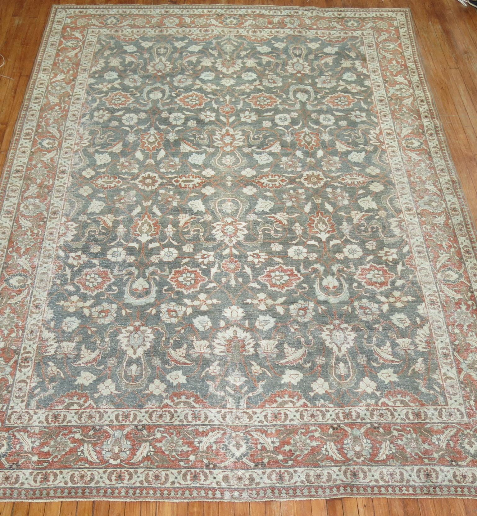 An early 20th century Persian Tabriz room size rug in green and orange

Measures: 8' x 11'6''.

 
