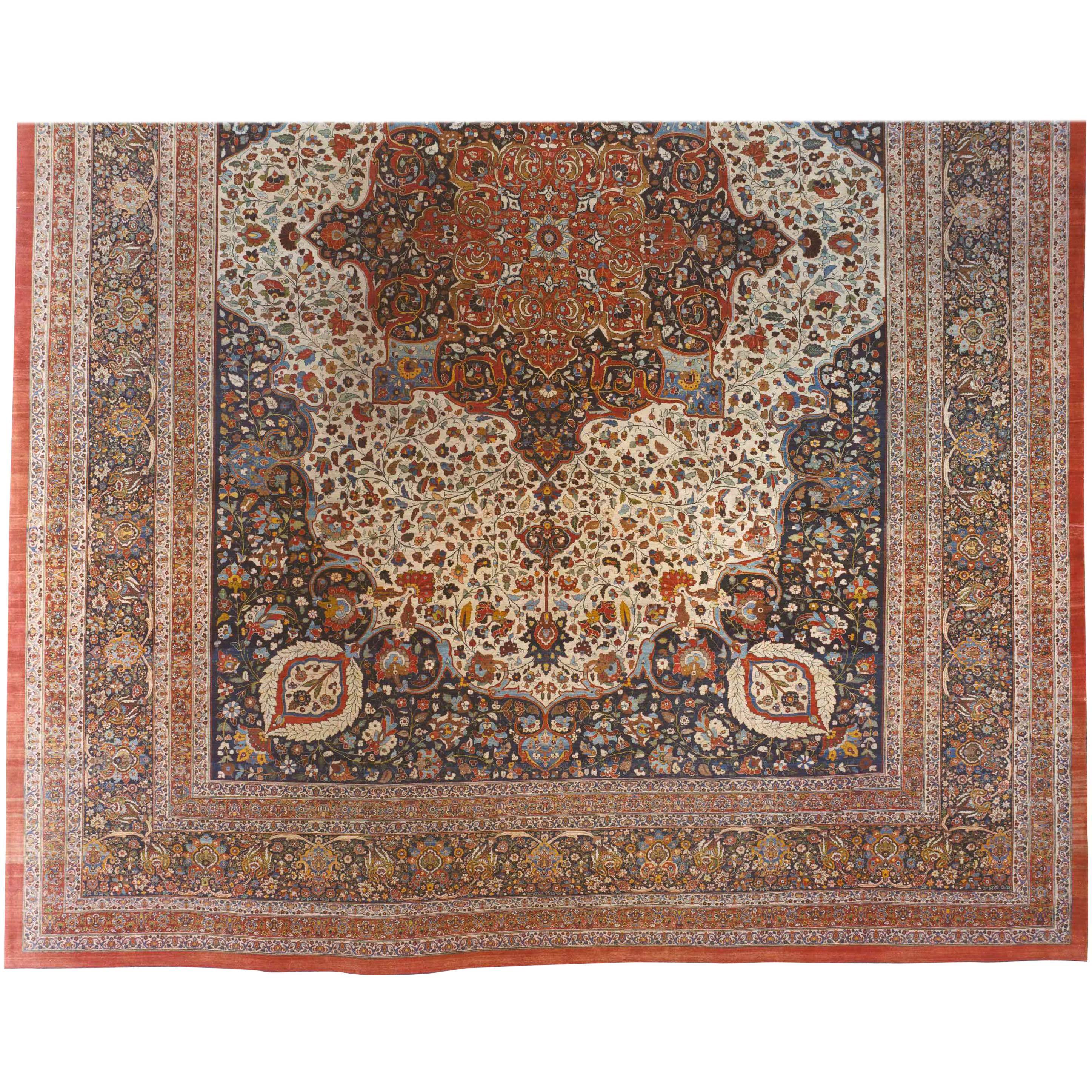 An antique Persian Tabriz Hadji Jalili oriental carpet, circa 1890. Size 23'8 H x 17'6 W. This fine hand knotted wool carpet features a Classic Persian design, with an elegant central medallion amidst a rarely found ivory field, and with reciprocal