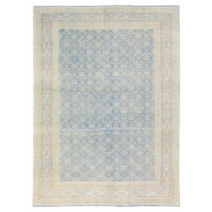 Tapis persan ancien de Tabriz en laine bleue à motifs floraux fait à la main