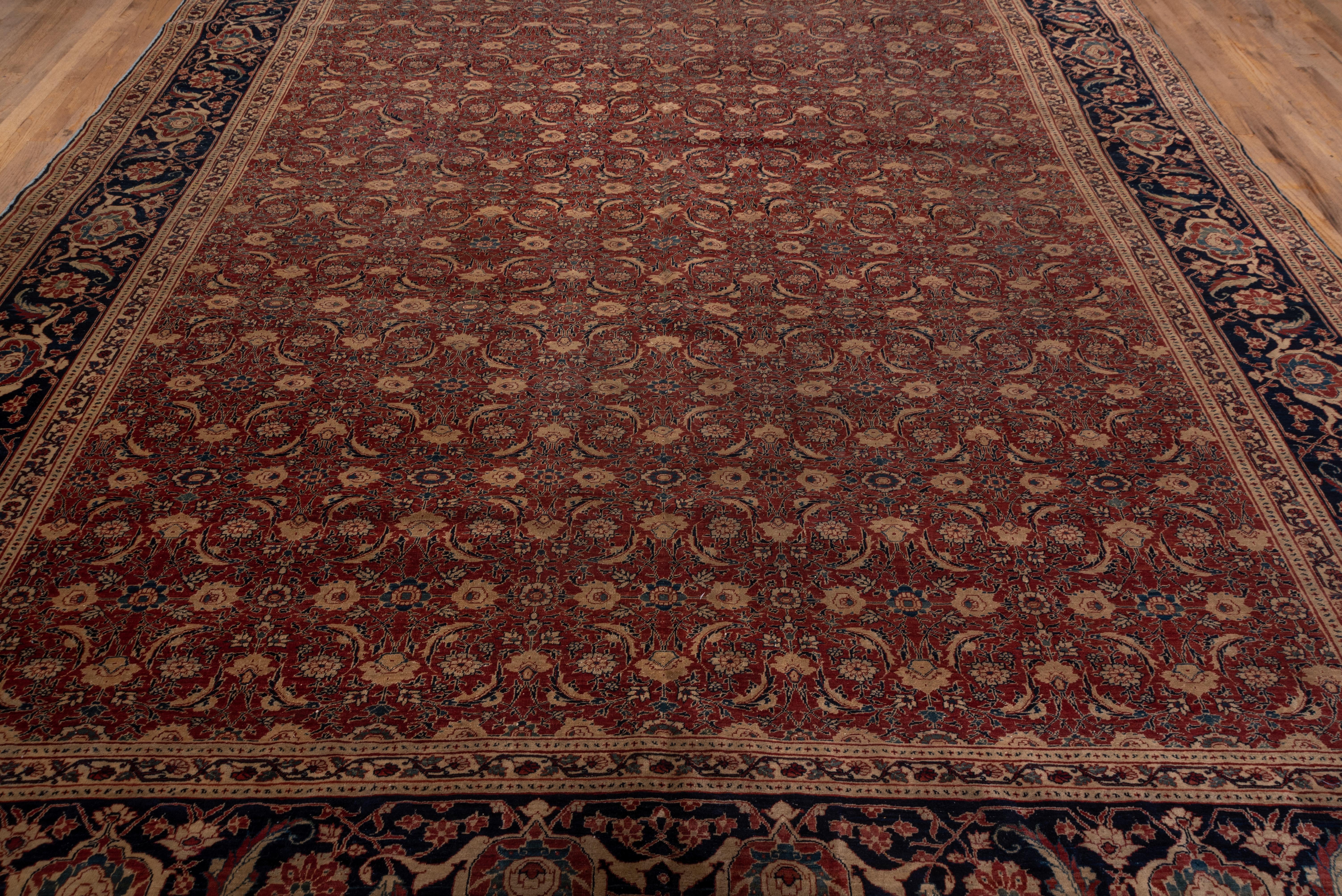 The red field is densely patterned by the Tabriz Herati design, while the equally iconic reversing turtle palmette, lancet leaf and rosette border makes the proper frame for this good condition NW Persian urban carpet.