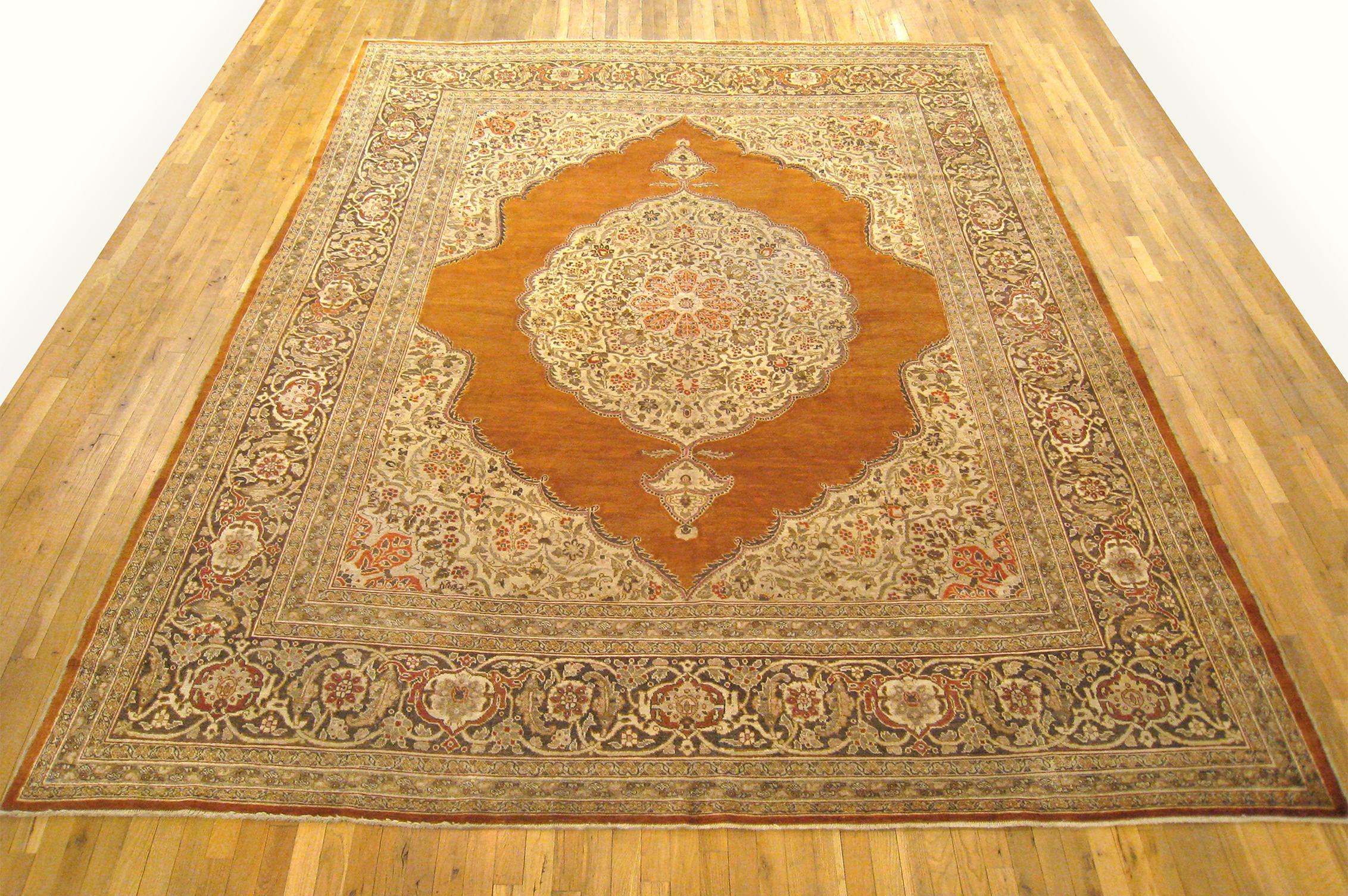 Antique Persian Tabriz oriental carpet, circa 1900, room sized.

An antique Persian Tabriz oriental carpet, circa 1900. Size: 12'9