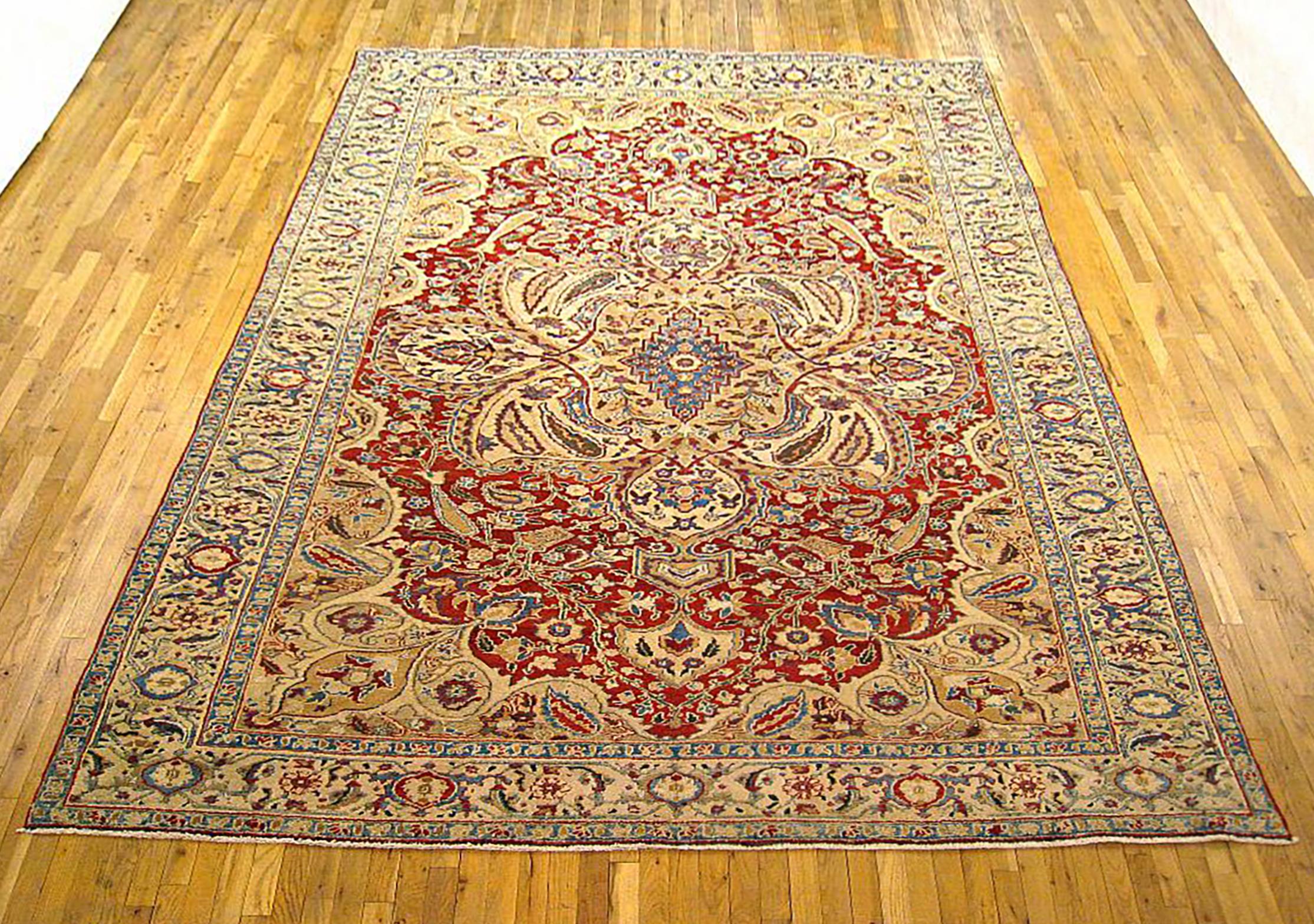 Antique Persian Heriz Oriental Rug, Room size

An antique Persian Heriz oriental rug, size 12'2 x 8'4, circa 1920.  This handsome hand-woven geometric rug features a central medallion on the soft red field.  The central field is enclosed within an