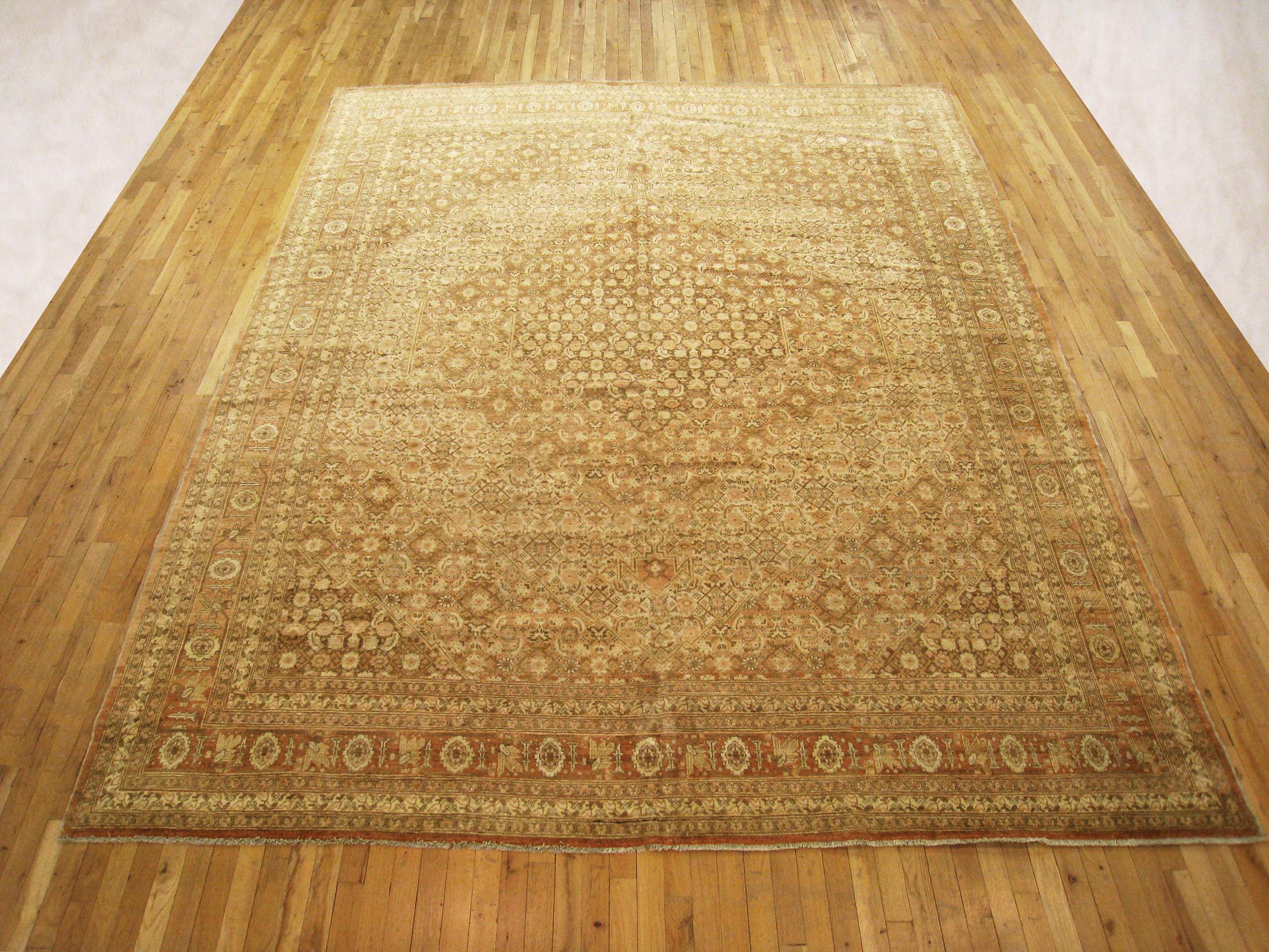 Antique Persian Tabriz  Oriental Carpet, circa 1910, Room Sized

An antique Persian Tabriz oriental carpet, circa 1910. Size: 12'0