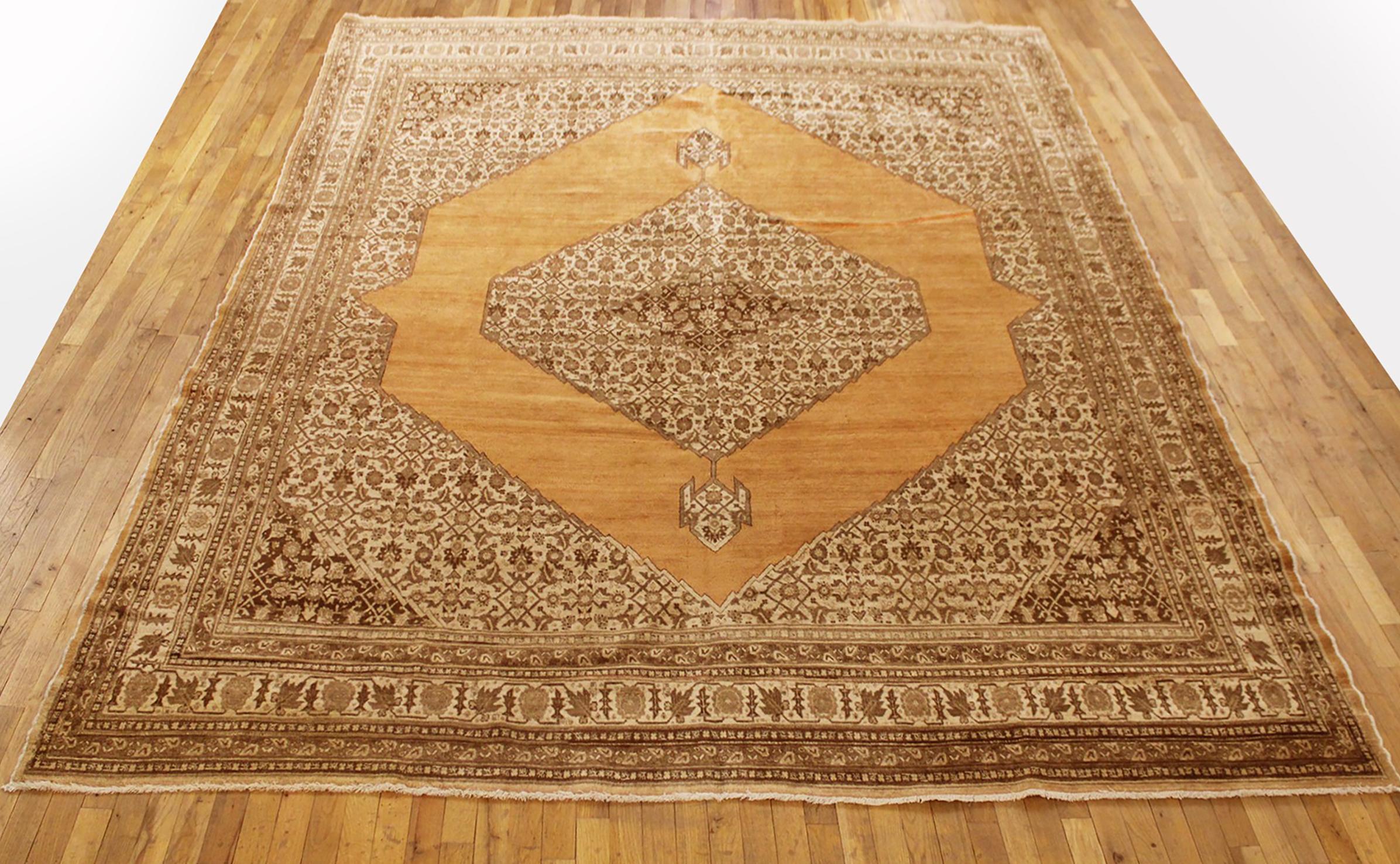 Antique Persian Tabriz Oriental carpet, circa 1900, Room Size.

An antique Persian Tabriz oriental carpet, circa 1900. Size: 11'8