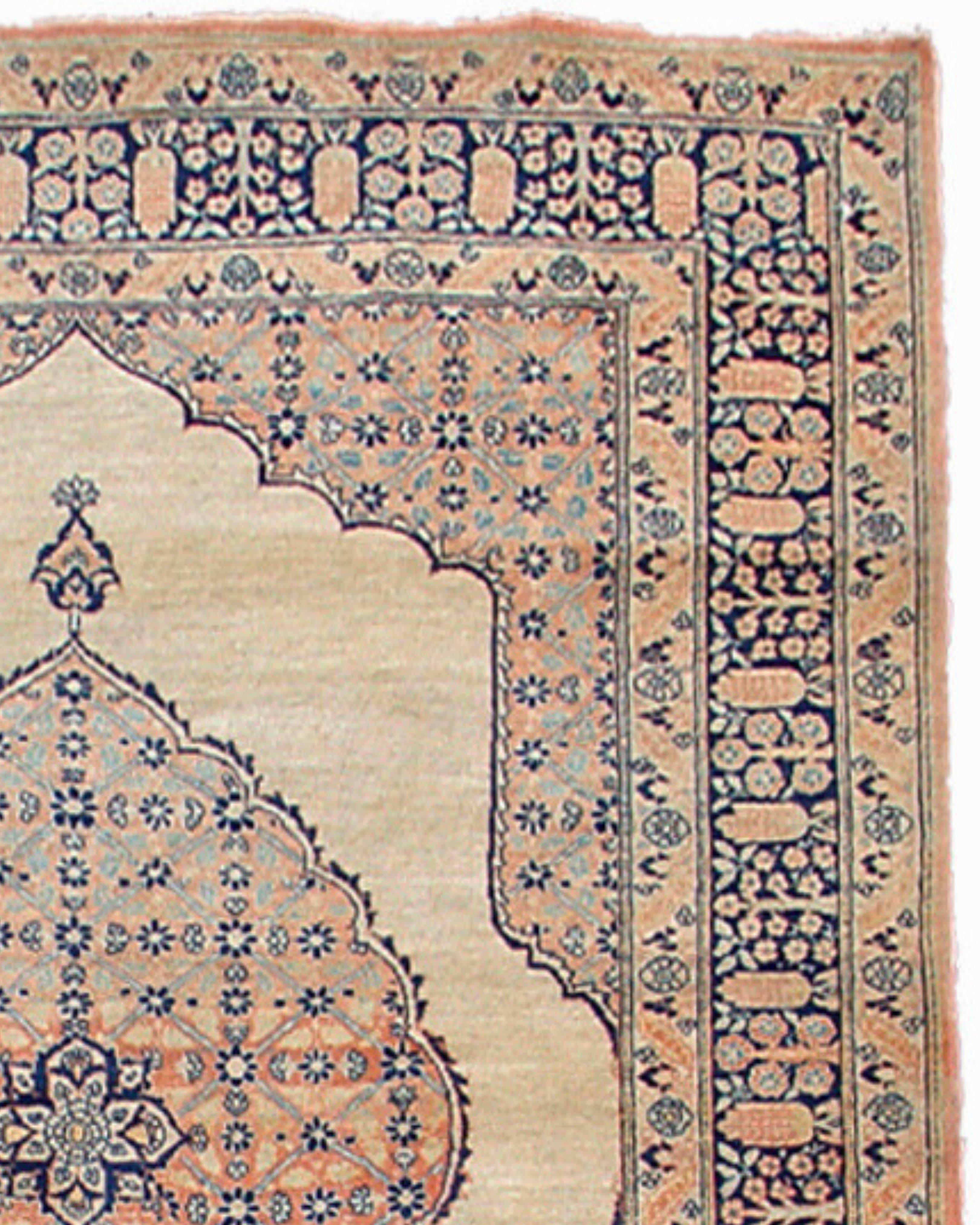 Antique Persian Tabriz Rug, 19th Century

This traditional antique Tabriz carpet from northwest Persia features a prominent elliptical medallion floating on an ivory field. Though dating from the later nineteenth century, the medallion and