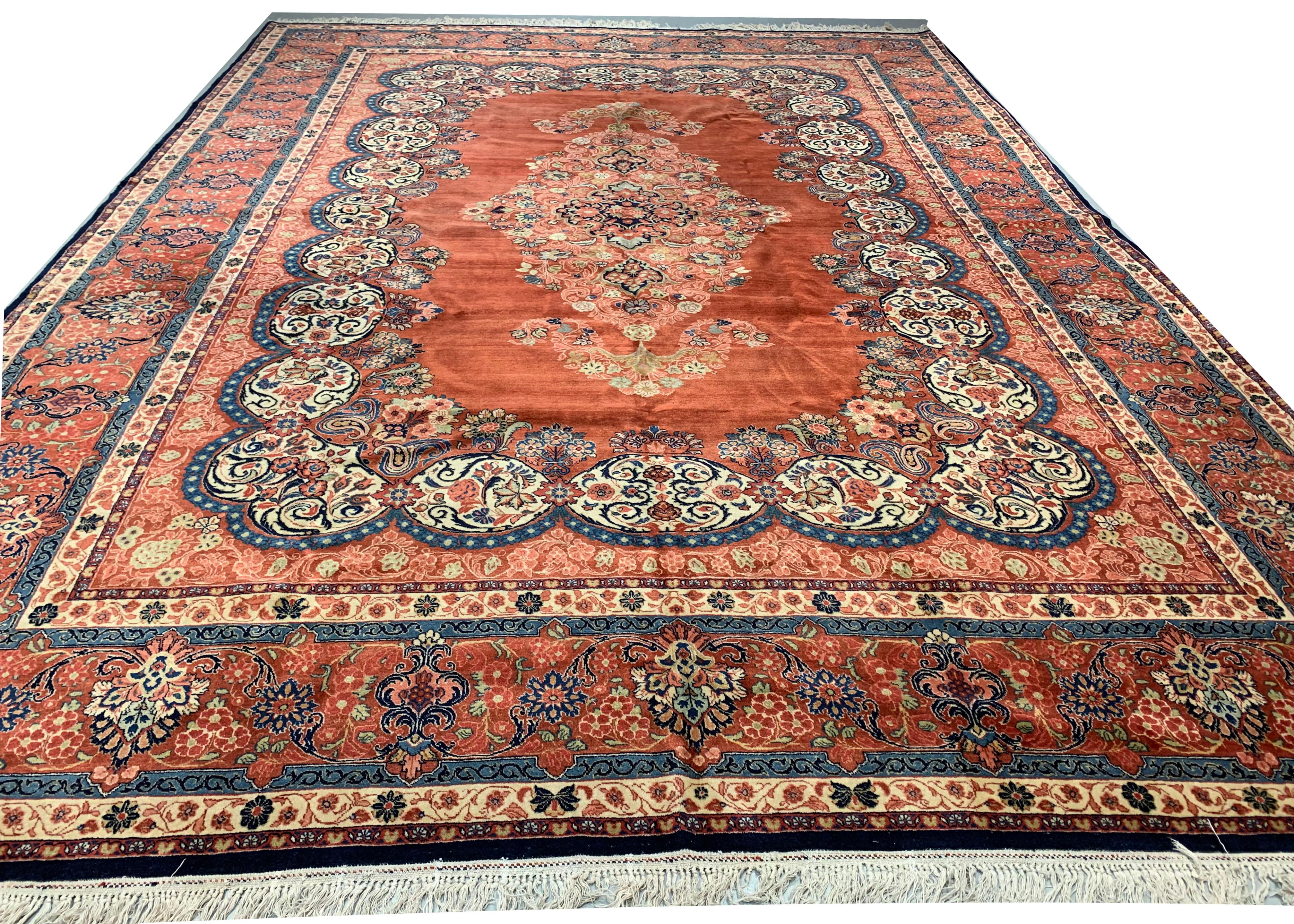 Antique Persian Tabriz rug 9'10 x 13'9. A wonderful Tabriz rug the central medallion filled with floral elements surrounded by ivory swirls repeating the floral theme. Enclosed by a main border and two guard borders again continuing the flower