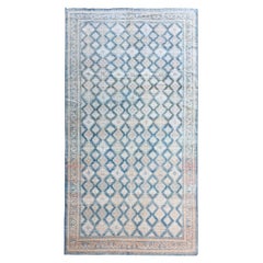 Ancien tapis persan de Tabriz bleu ivoire rouille brun clair