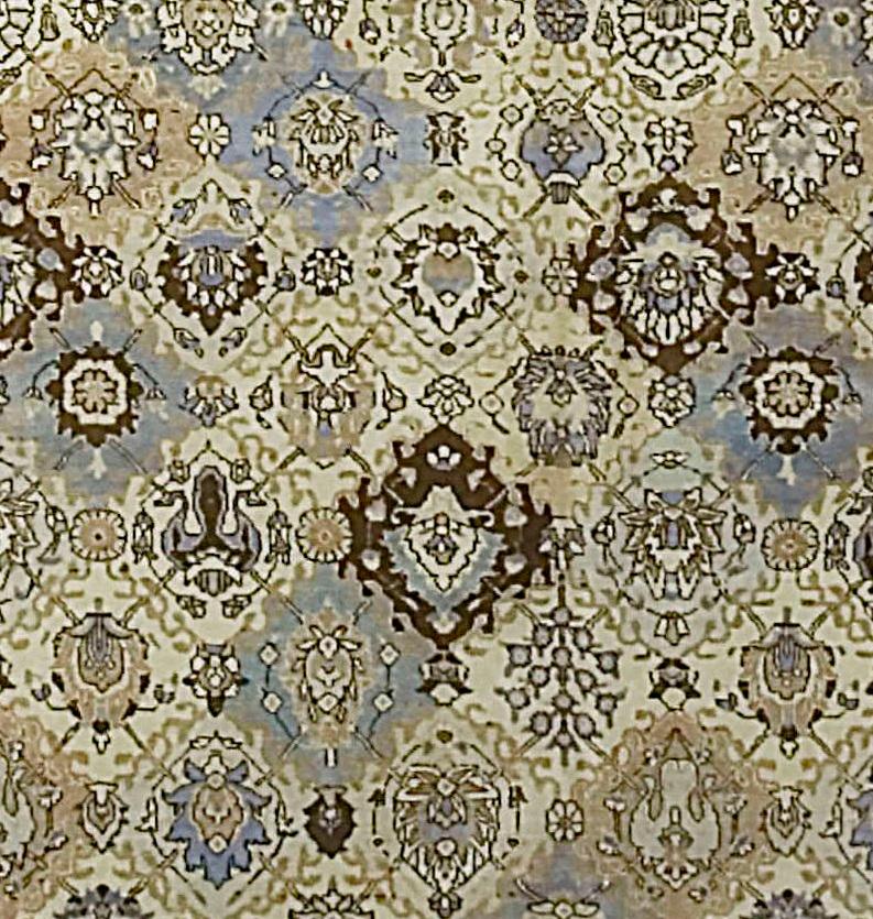 Antique Persian Tabriz rug, circa 1920. A wonderful design on this 1920s Persian Tabriz rug. The floral designs enclosed in diamond shaped with no harsh outlines to break the soft flow and gentle feel to this rug. Size: 9'10 x 12'10.