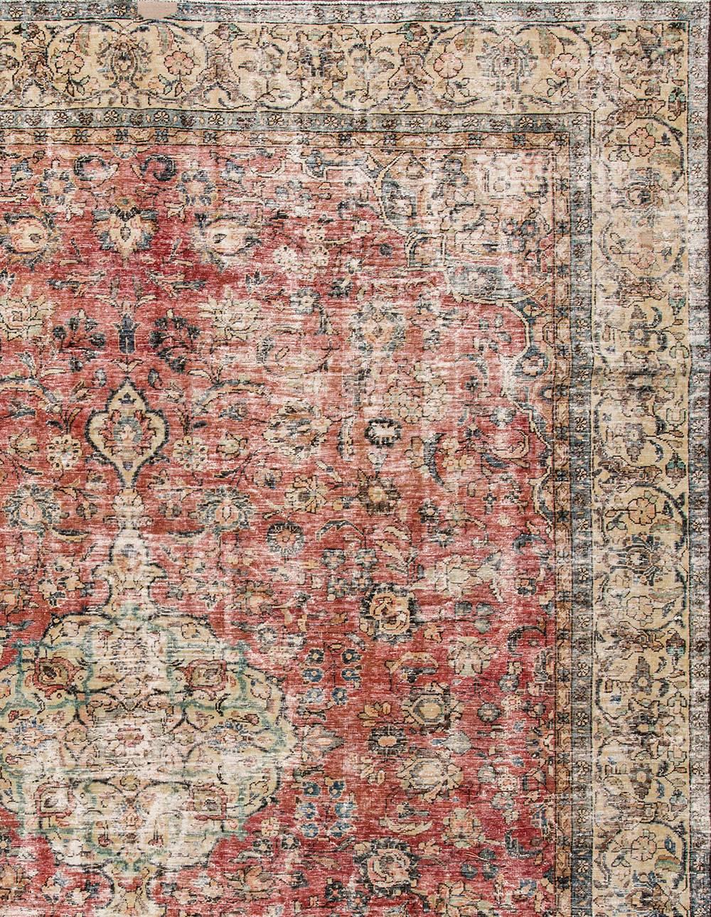 Antique hand-knotted Persian Tabriz distressed rug with a subtle all-over motif. This rug measures 11'10