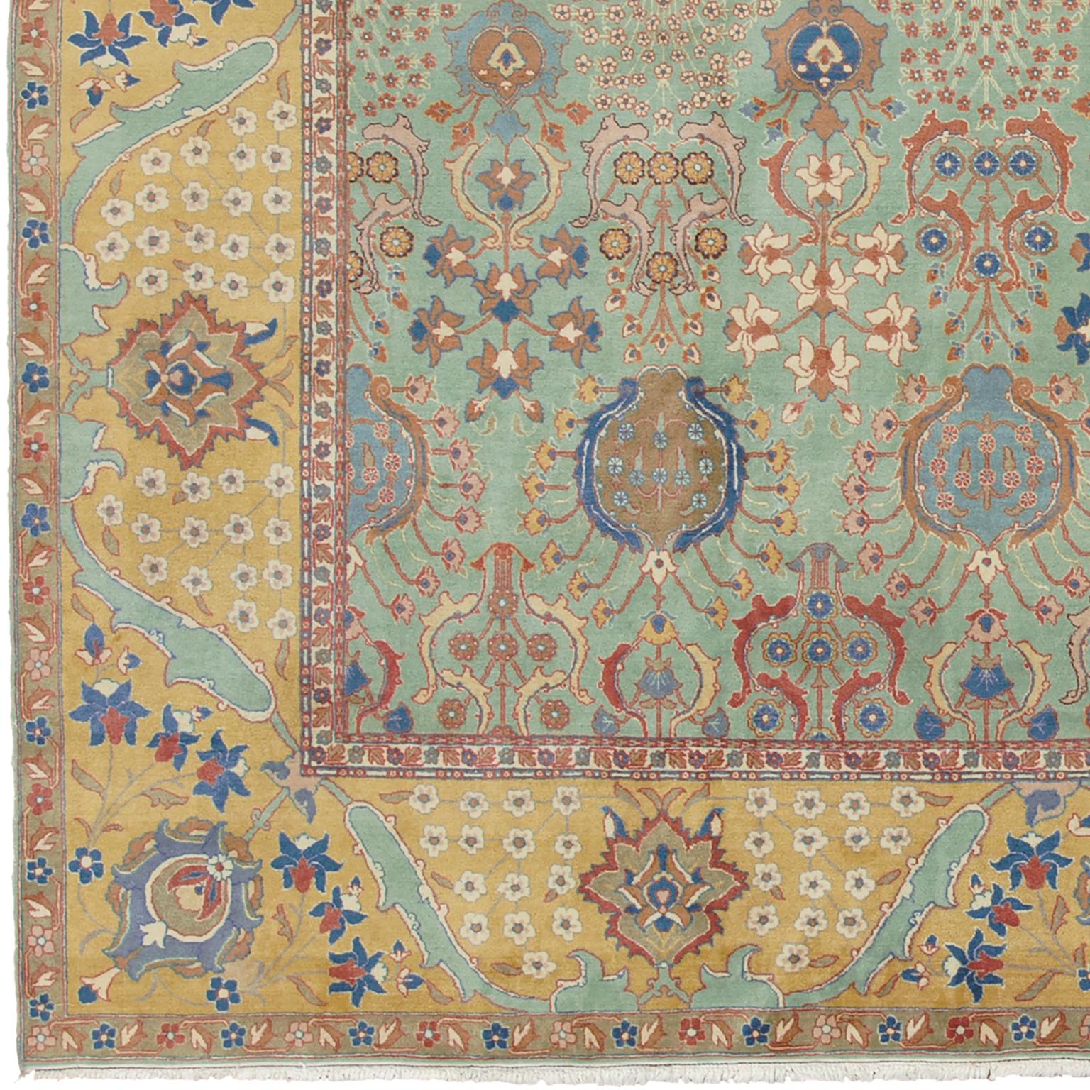 Antique Persian Tabriz rug
North-West Persia, circa 1920
Handwoven
The overall design of flowering palmettes and naturalistic floral sprays on the present carpet clearly derives from a 17th century Isfahan carpet that is in the Museum fur