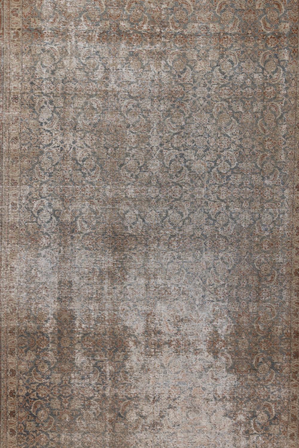 Age: early 20th century 

Pile: Low

Wear Notes: 5

Material: Wool on Cotton

Beautiful distressed Persian Tabriz with an all over herati pattern and neutral warm color way. The open field without corner brackets makes this piece