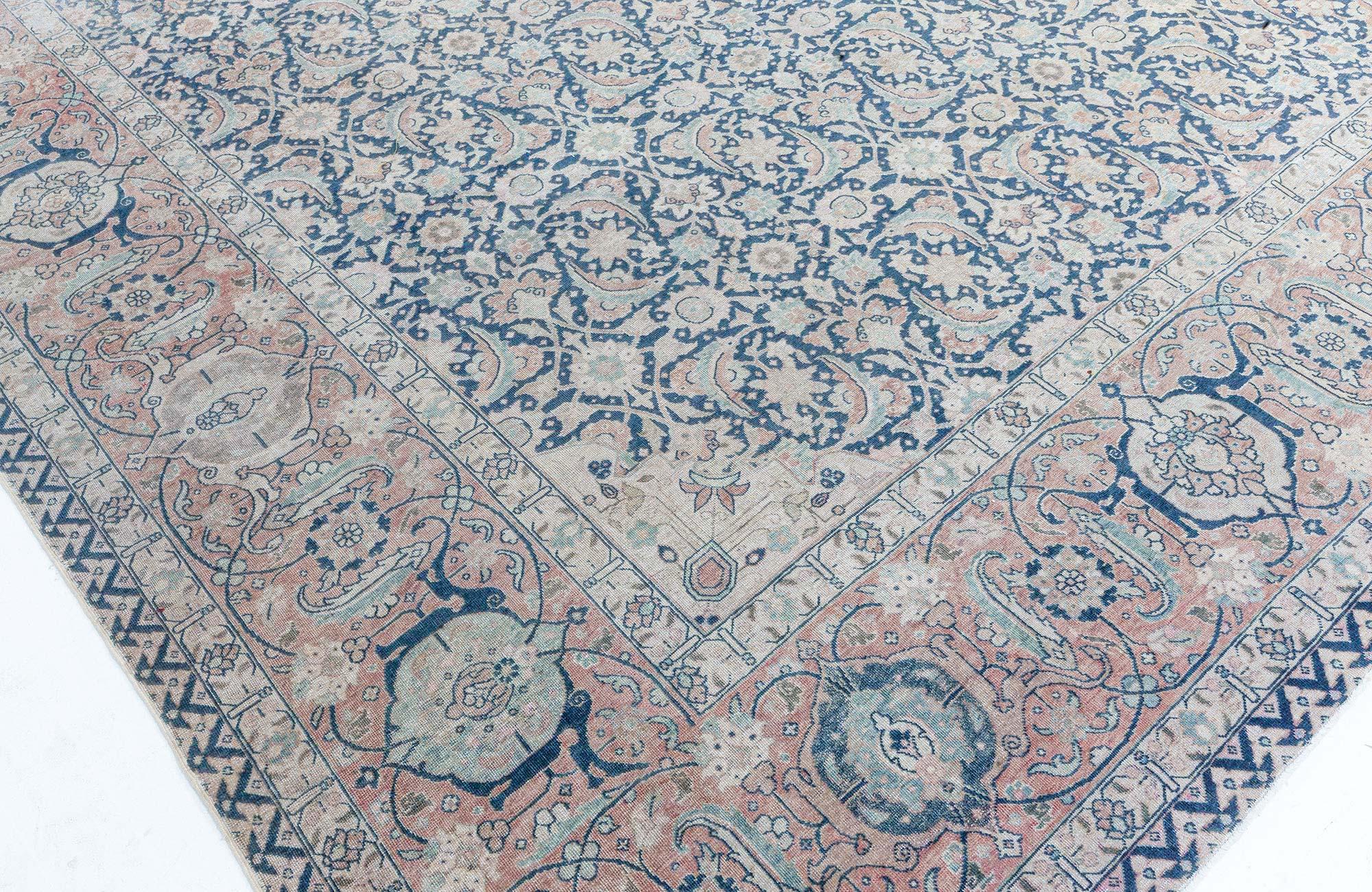 Antique Persian Tabriz rug.
Size: 13'9