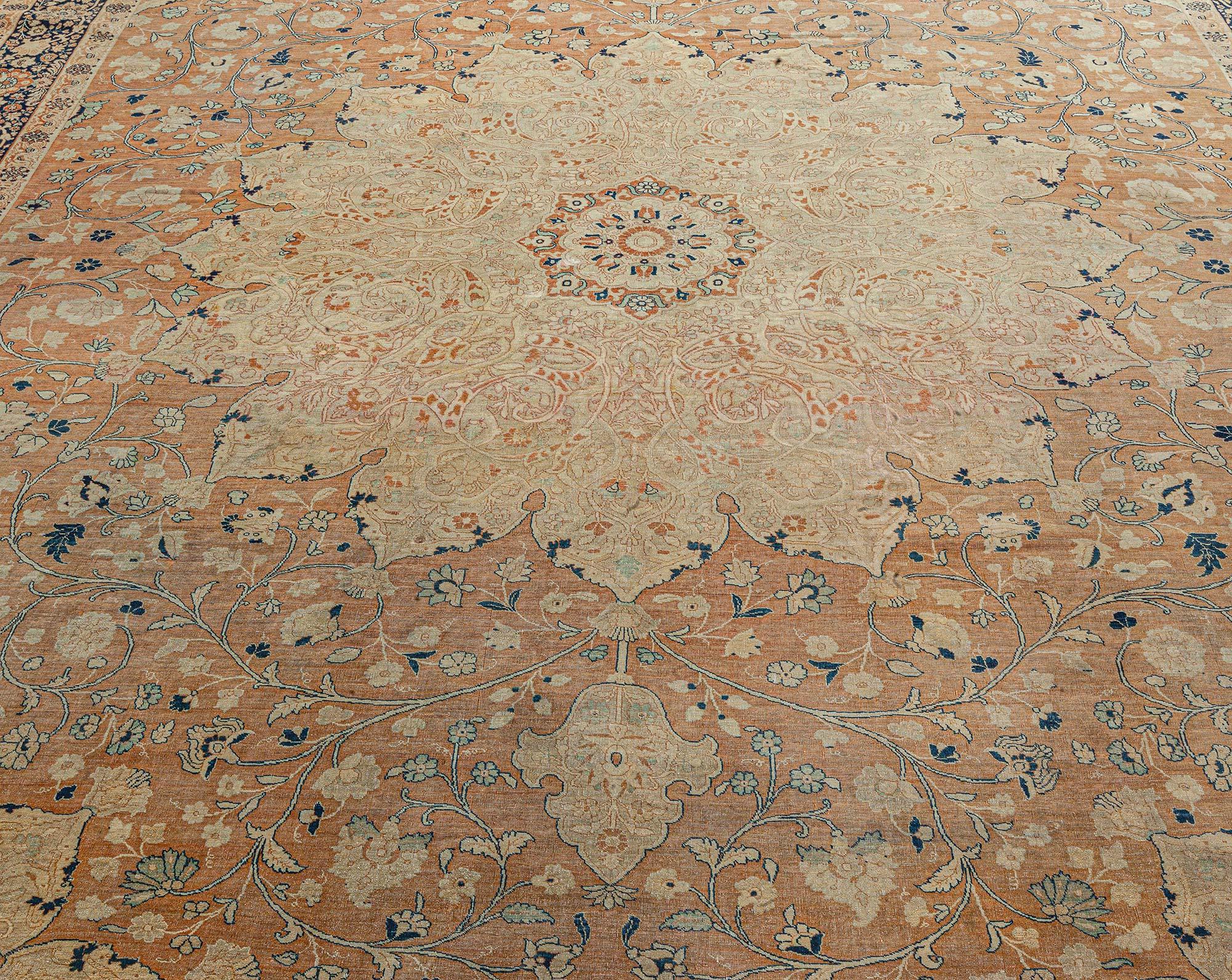 Antique Persian Tabriz rug 
Size: 11'2