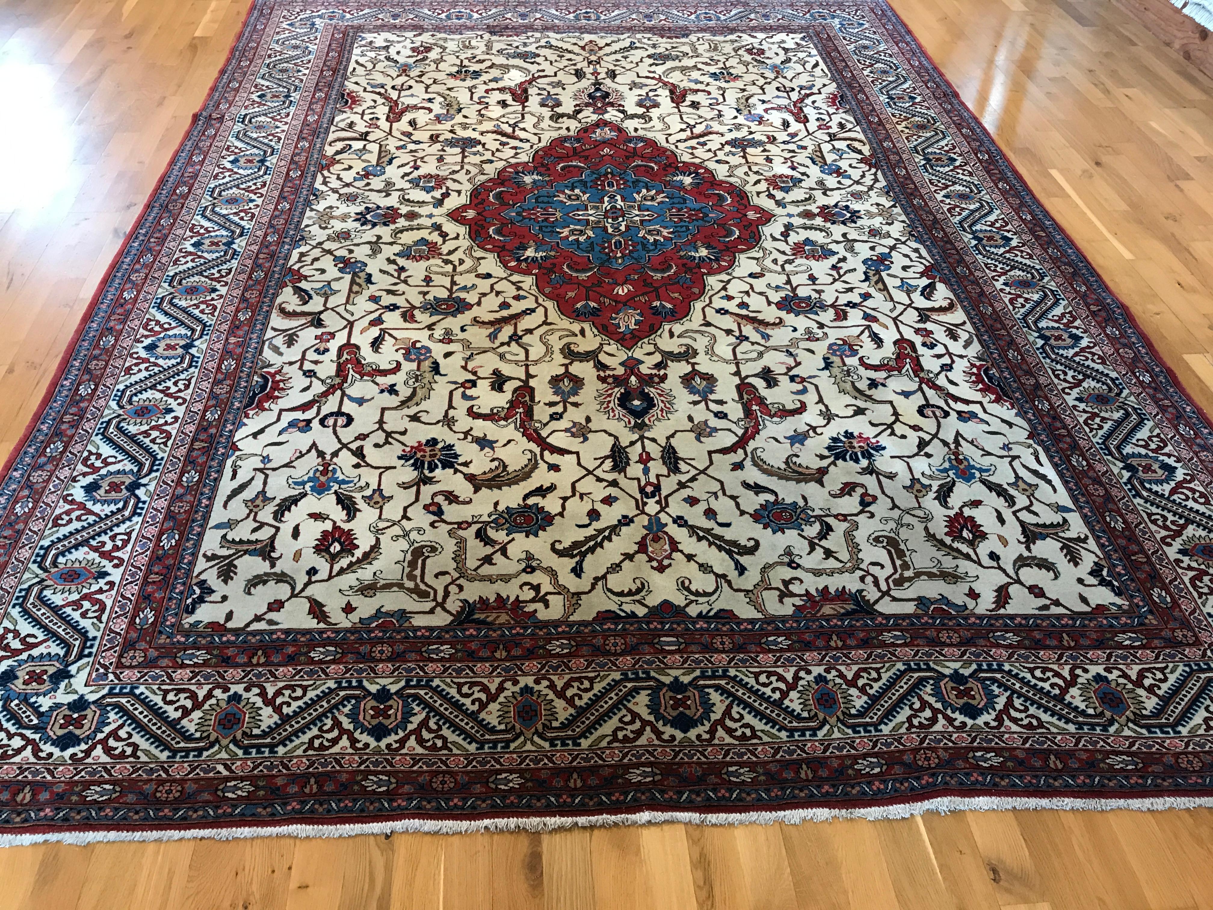 Exude elegance and sophistication with this antique Persian Trabriz rug. Its exquisite design, crafted with all wool, adds a luxurious touch to any room. Discover the timeless beauty of this piece that has stood the test of time.
