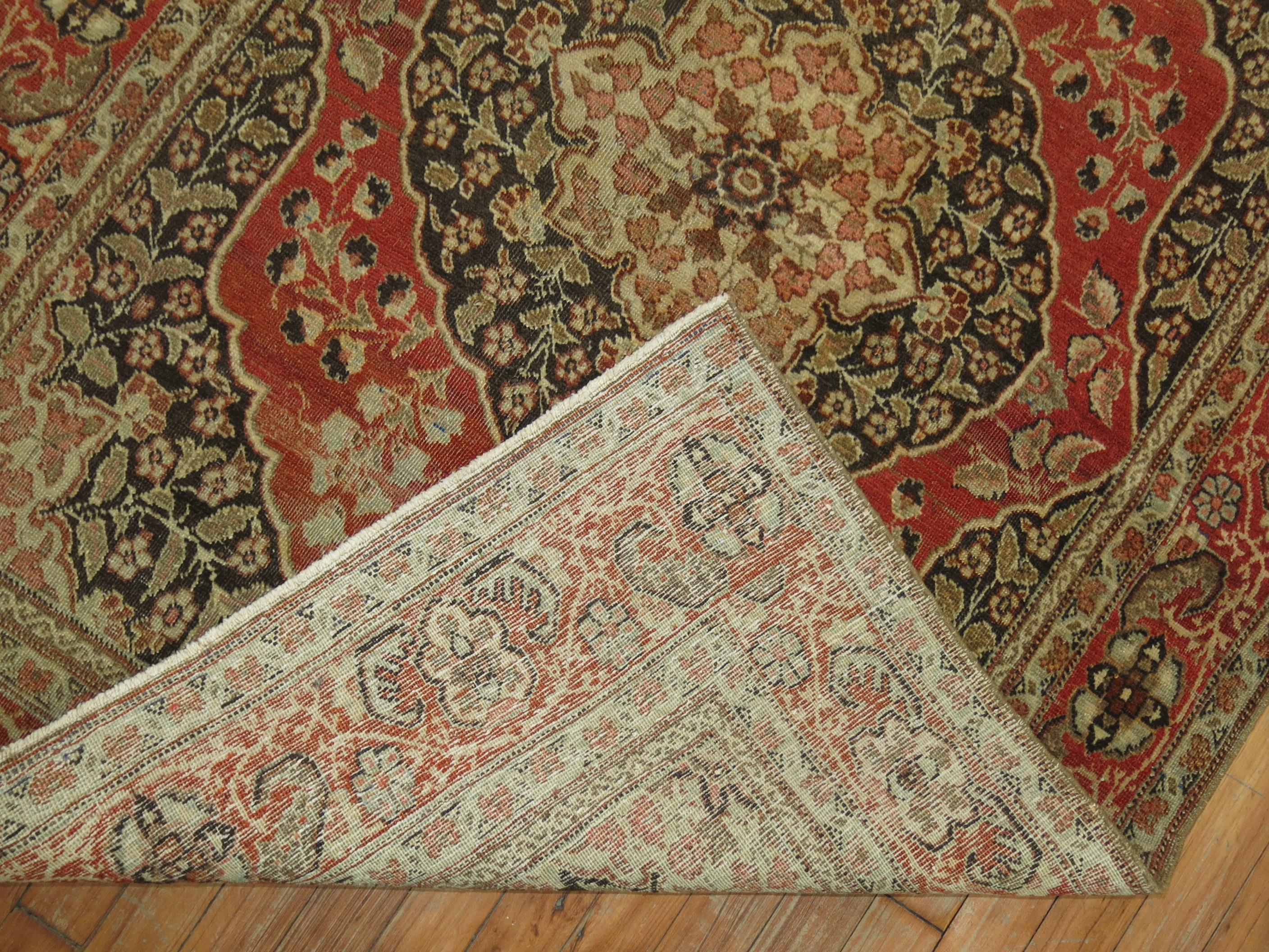 An early 20th century authentic antique Persian Tabriz rug.

3'9'' x 5'2''