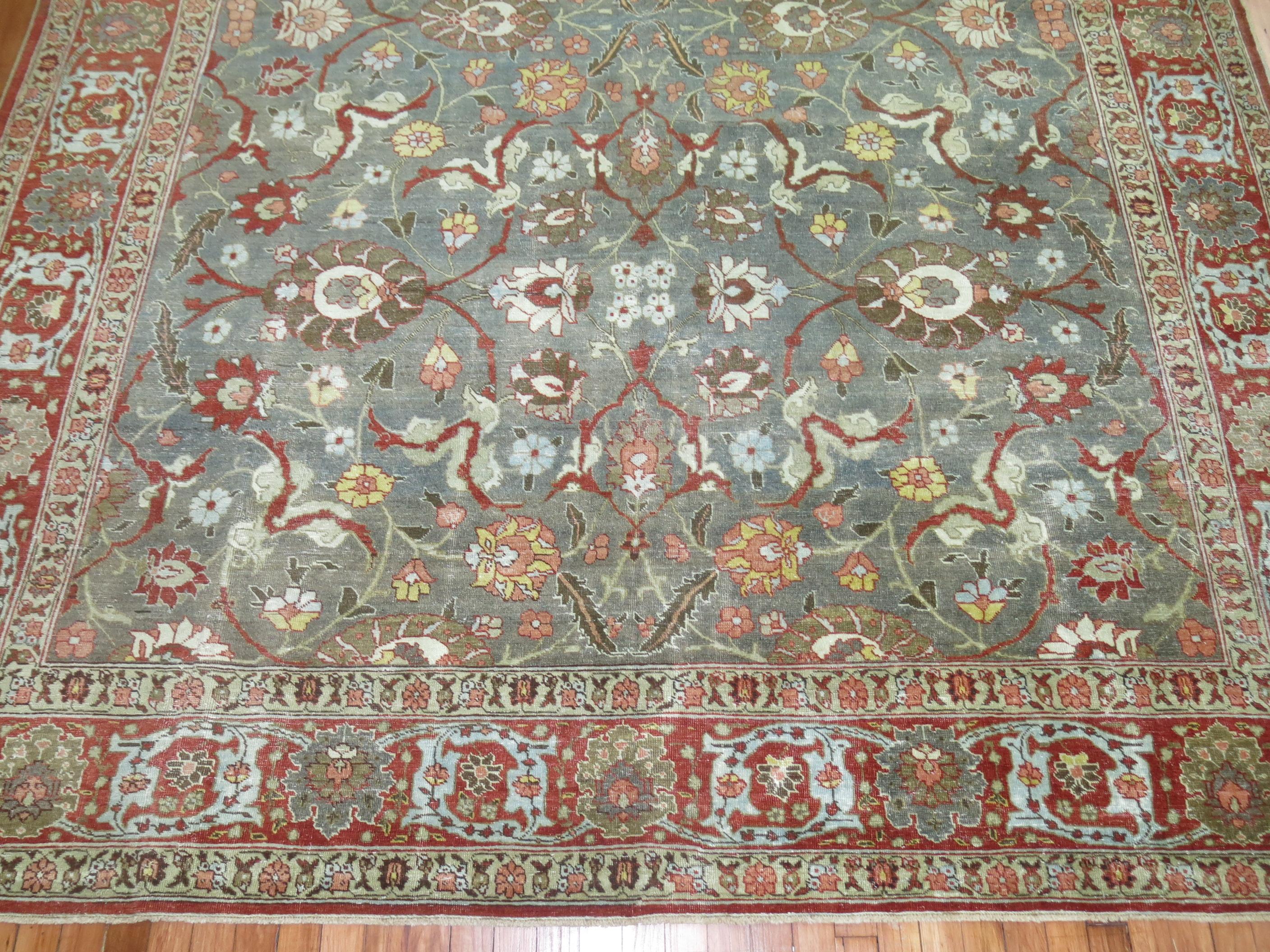 An early 20th century Persian Tabriz in dominant shades in green and brown

Measures: 8'3'' x 11'5''.
