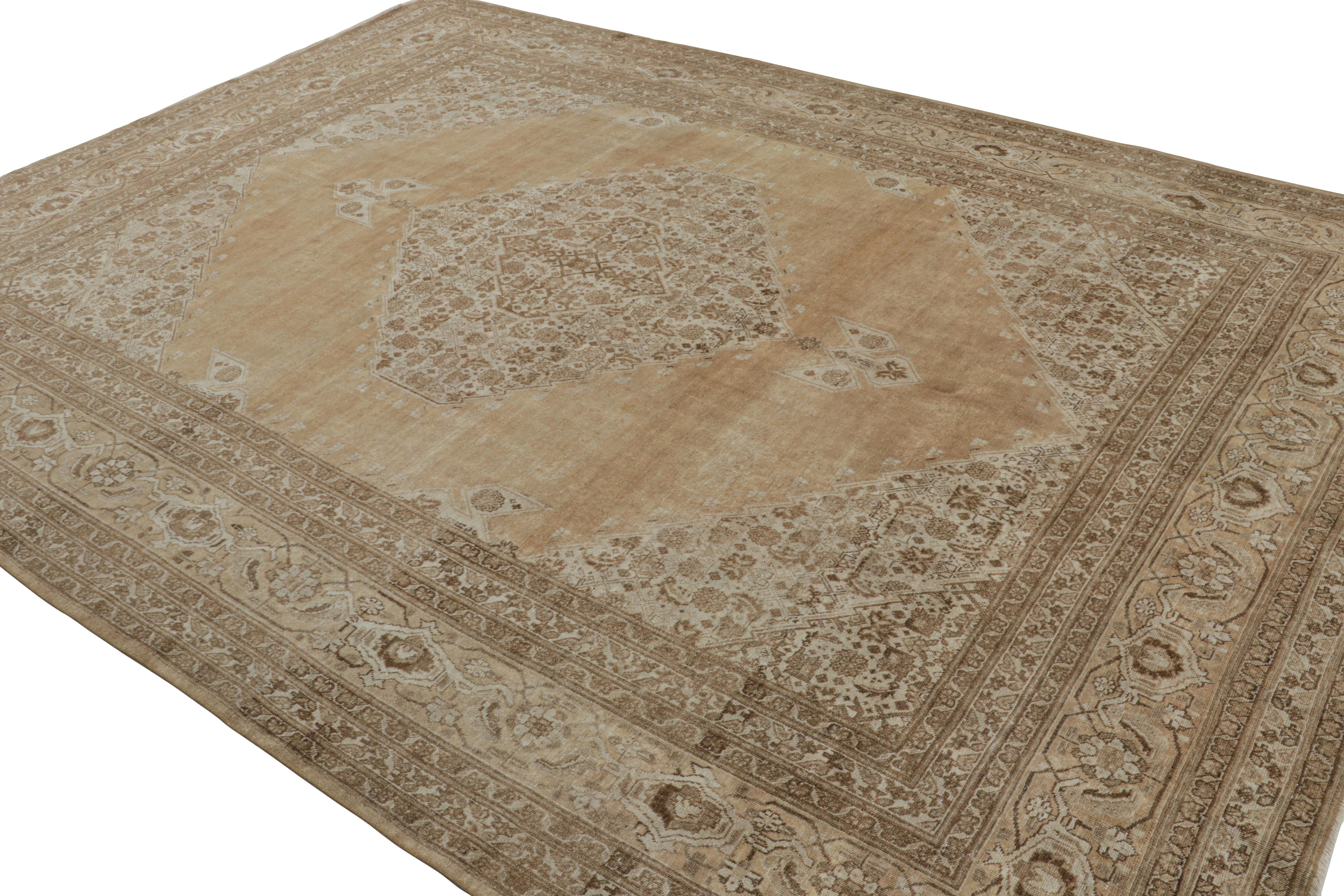 Hand-knotted in luxurious wool, this 9x12 antique Persian Tabriz rug features a rich design combination of floral patterns, medallions and open field style, which is almost unusual for a Tabriz rug to enjoy but masterfully done as they are. 

On the