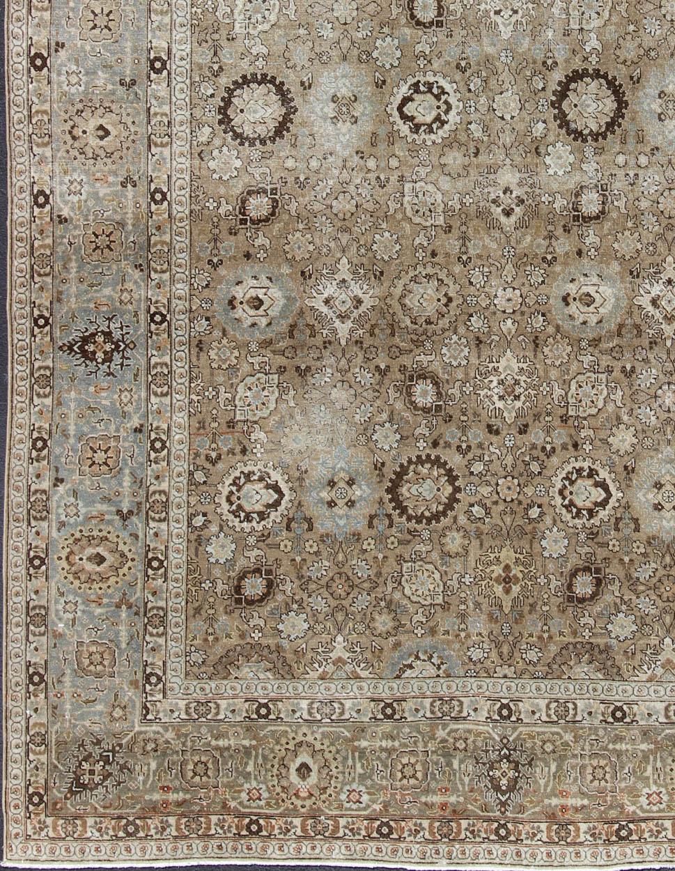 Tabriz Antique rug from Persia with all-over Floral Geometric design in earth tones, rug 18-0803, country of origin / type: Iran / Tabriz, circa 1920

This antique Persian Tabriz carpet features a refined palate of mocha, camel, brown, gray, and
