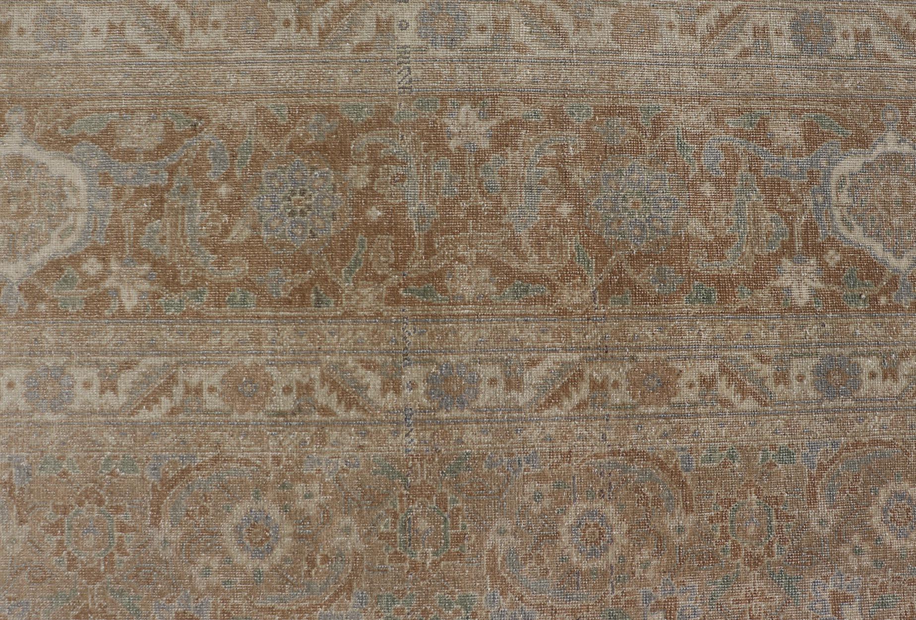 Antique Persian Tabriz Rug in Wool with All-Over Floral Design in Earth Colors In Good Condition For Sale In Atlanta, GA