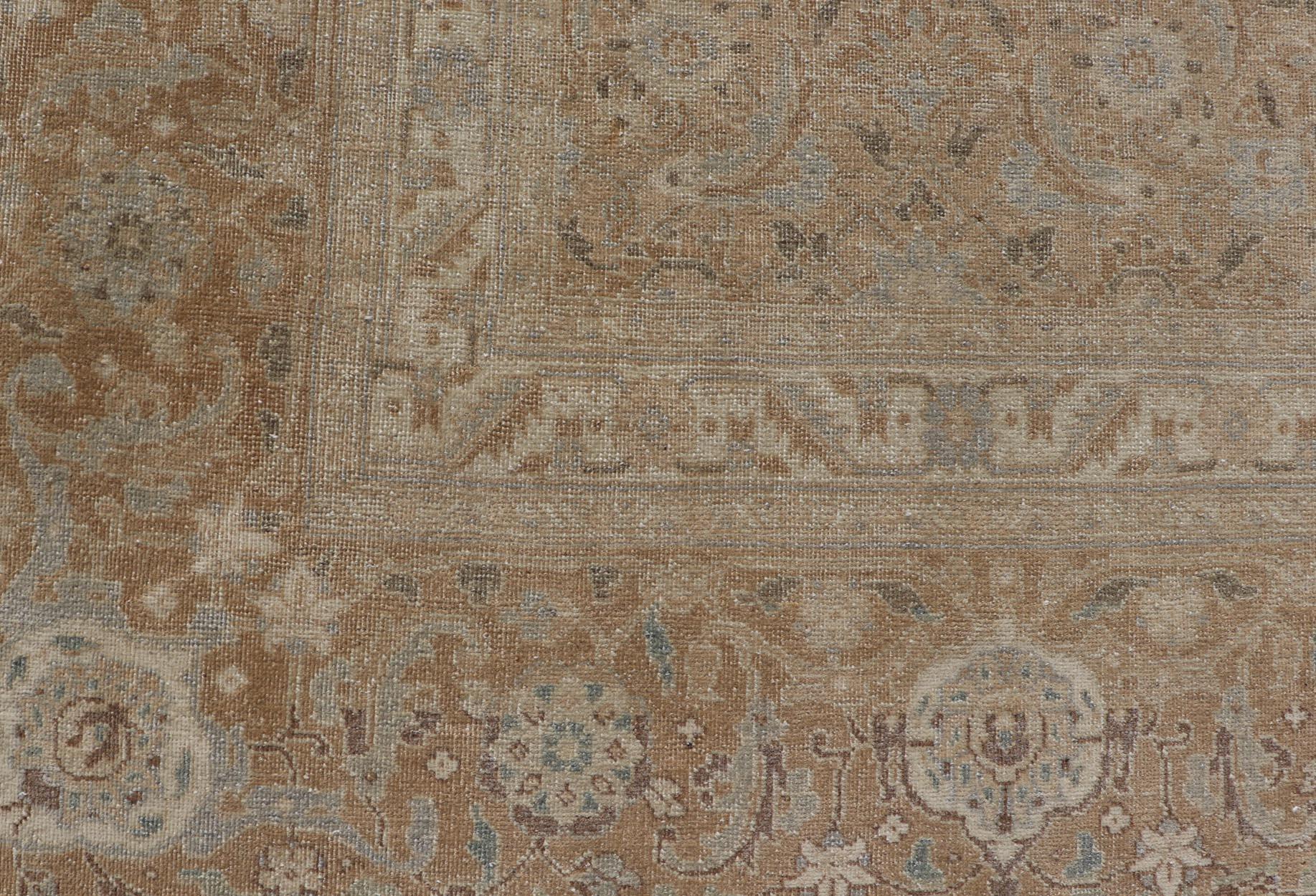 20th Century Antique Persian Tabriz Rug in Wool with All-Over Floral Design in Earth Colors For Sale