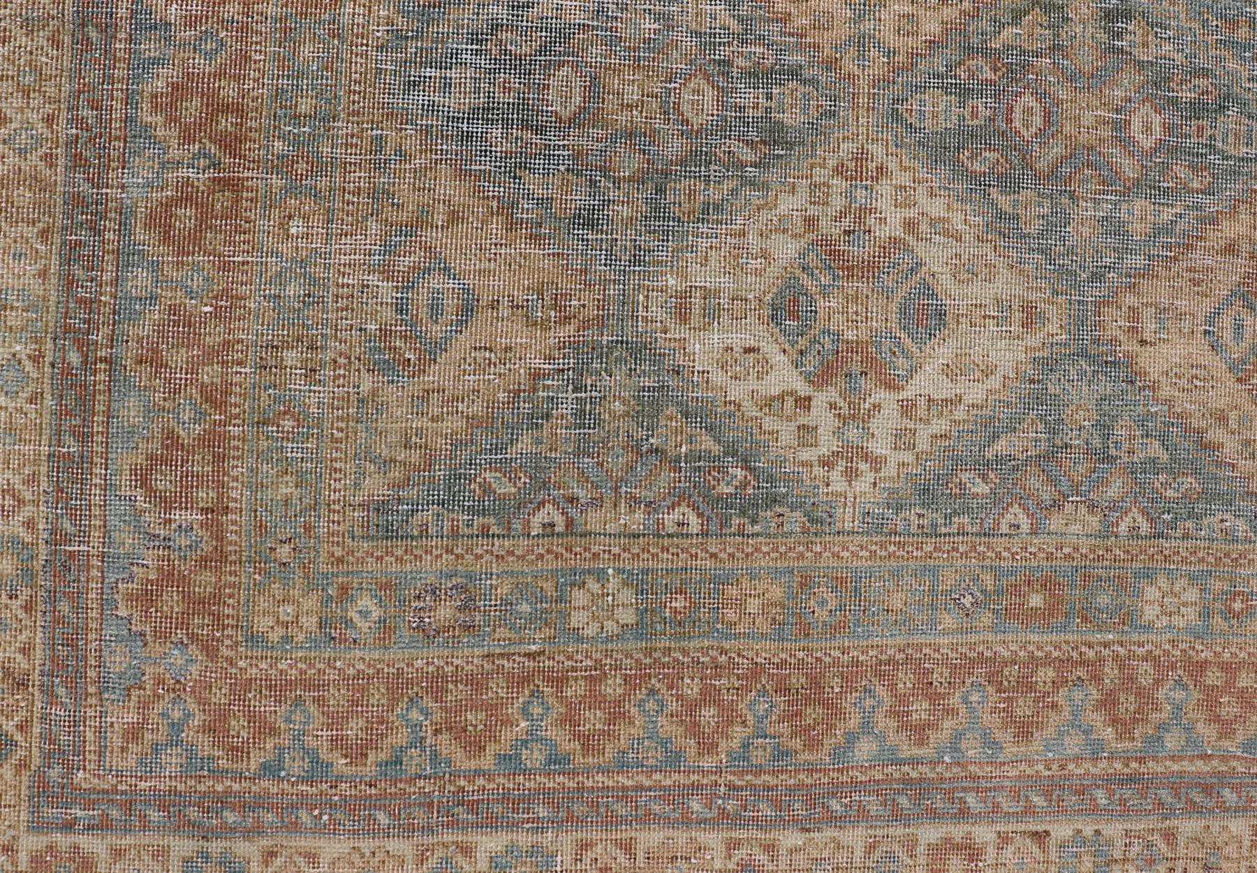 Square shape Antique Persian Tabriz Rug in Wool with repeating Diamond Design in Blue, Apricot, butter & Gray. Keivan Woven Arts / rug VAS-189102, country of origin / type: Iran / Tabriz, circa 1920s.

Measures: 5'4 x 6'7 

This Tabriz rug