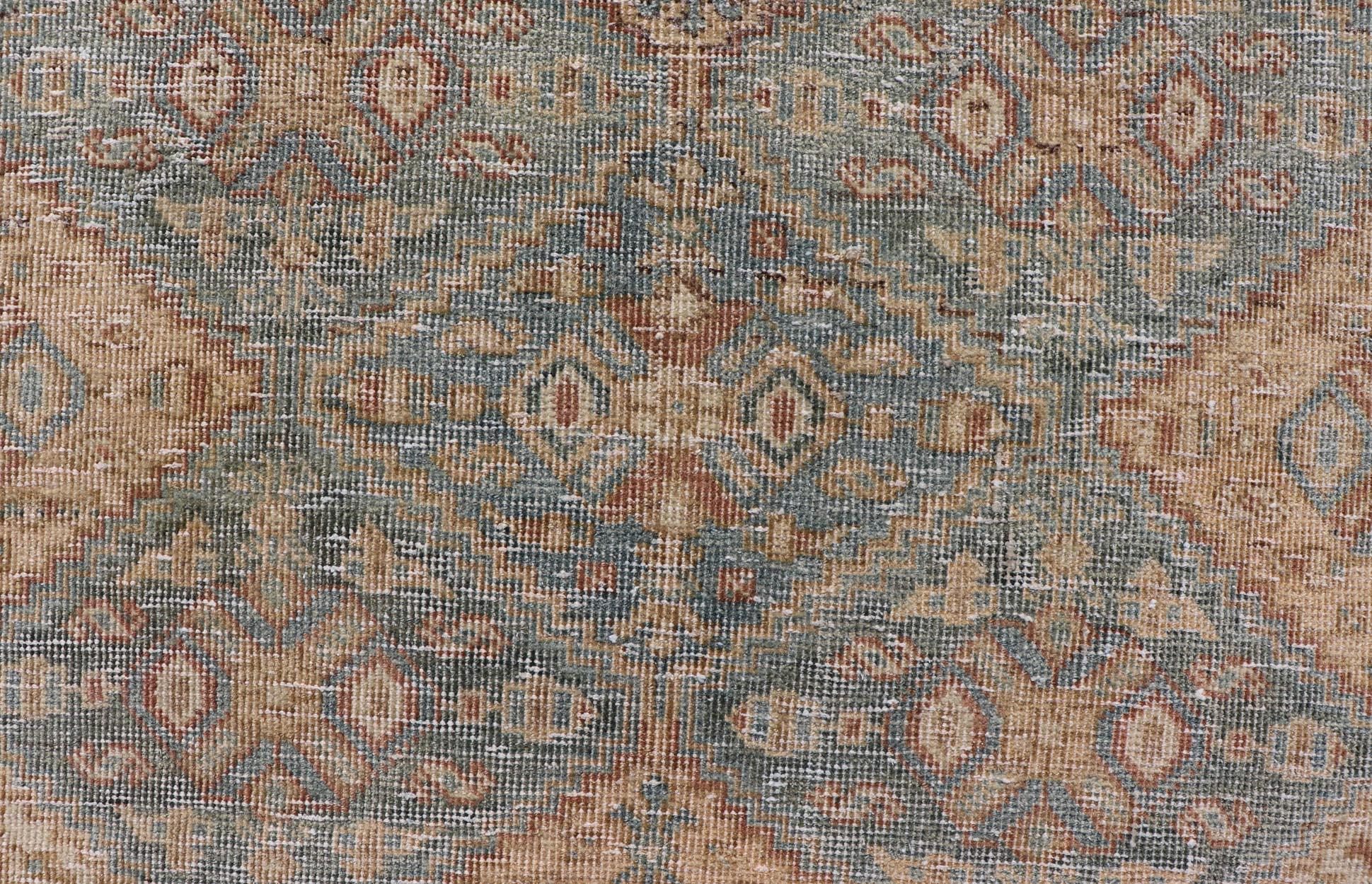 Hand-Knotted Antique Persian Tabriz Rug in Wool with Diamond Design in Blue, Apricot & Gray For Sale