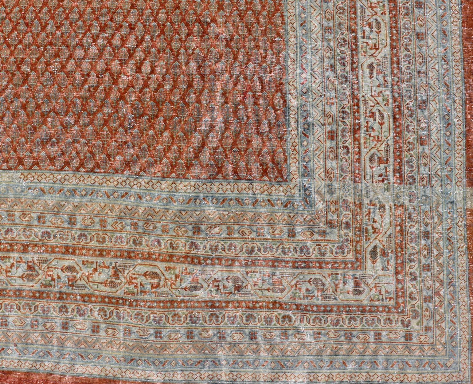 20th Century Antique Persian Tabriz Rug with All-Over Design in Copper-Red Background For Sale