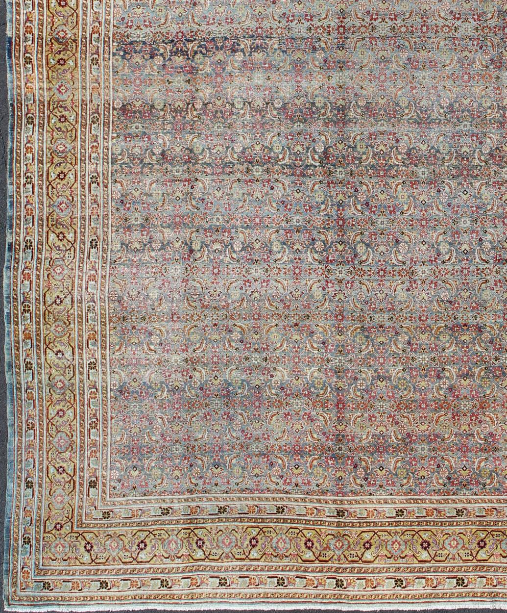 Large Antique Persian Tabriz rug with all-over Herati design. Keivan Woven Arts/ rug/ DAN-1700, country of origin / type: Iran / Tabriz, circa 1910

Measures: 12'8 x 18'5.

This magnificent early 20th century Persian Tabriz rug bears a beautiful,