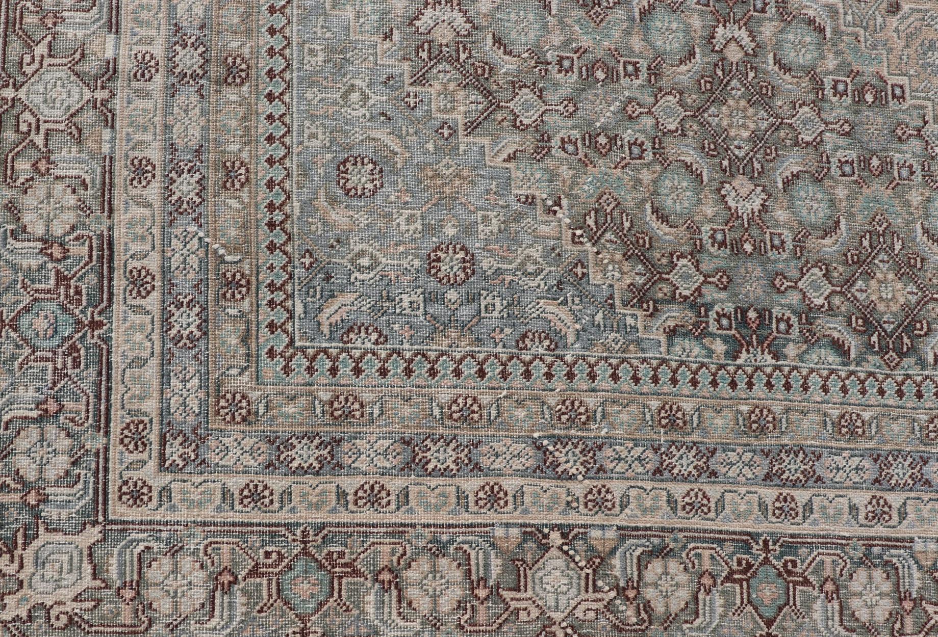 Measures: 8'9 x 12'2 
Antique Persian Tabriz Rug with All-Over Herati Design With Medallion Design. Keivan Woven Arts /  rug EN-4653, country of origin / type: Iran / Tabriz, circa 1920.

This magnificent 20th century Persian Tabriz rug bears a