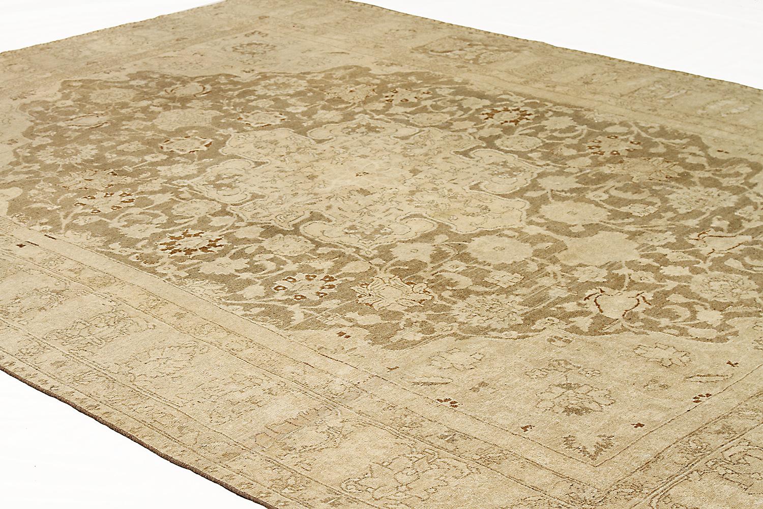 Hand-Woven Antique Persian Tabriz Rug with Beige and Brown Floral Medallion on Center Field For Sale