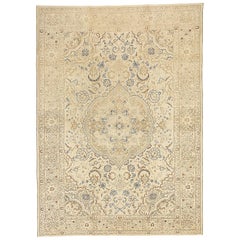 Vintage Persian Tabriz Rug with Black and Brown Floral Motifs on Ivory Field