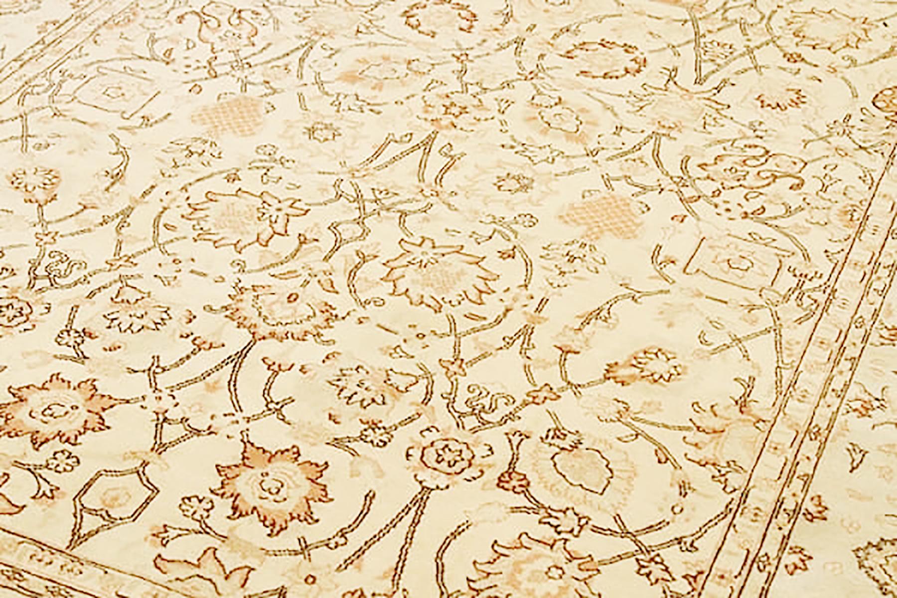 Hand-Woven Antique Persian Tabriz Rug with Black and Beige Floral Details Over Ivory Field For Sale