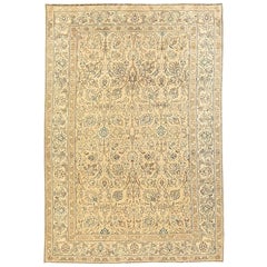 Vintage Persian Tabriz Rug with Black and Green Floral Details on Beige Field