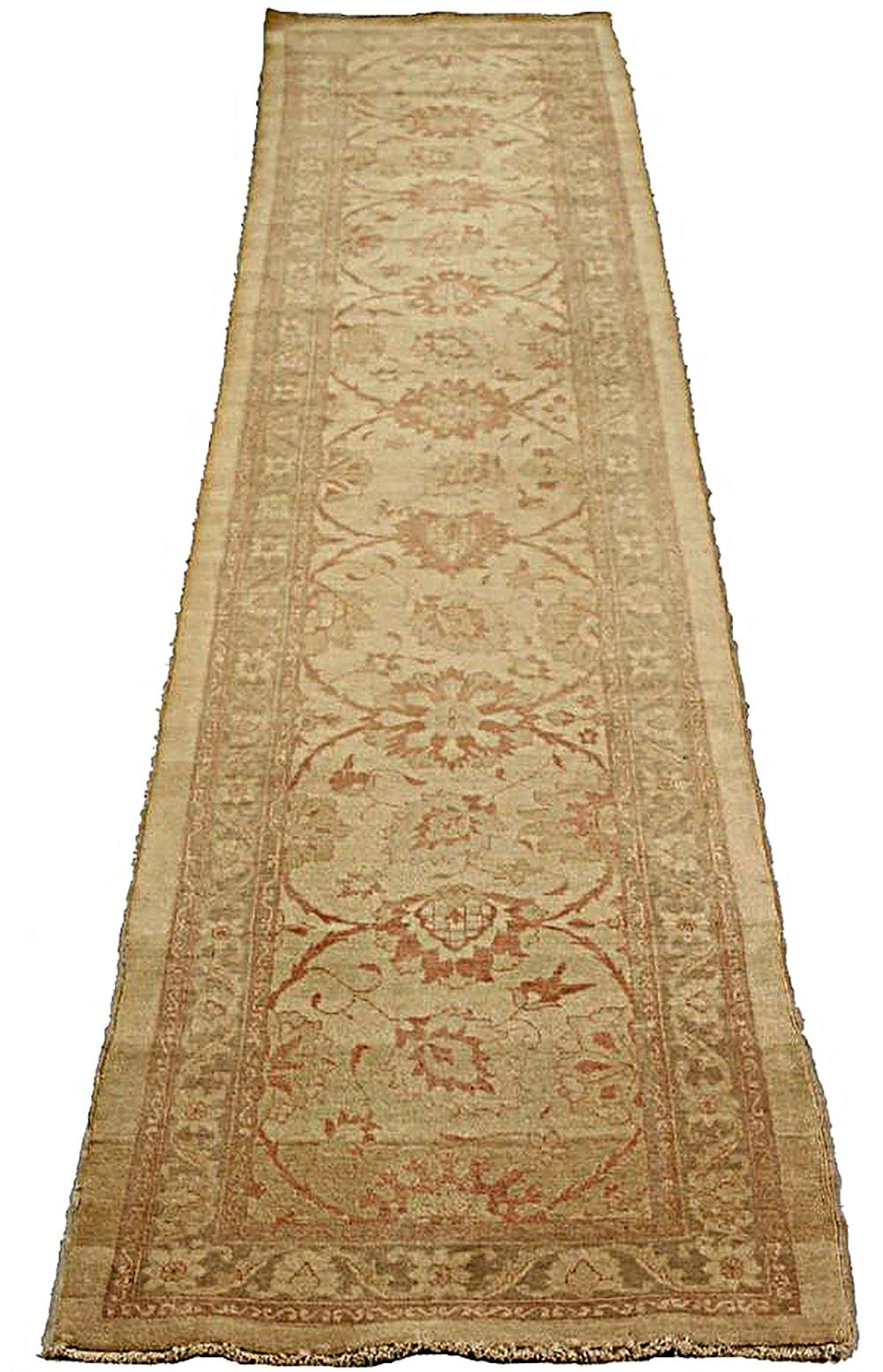 Antique Persian rug handwoven from the finest sheep’s wool and colored with all-natural vegetable dyes that are safe for humans and pets. It’s a traditional Tabriz weaving featuring a lovely ensemble of floral designs in beige and brown. It’s a