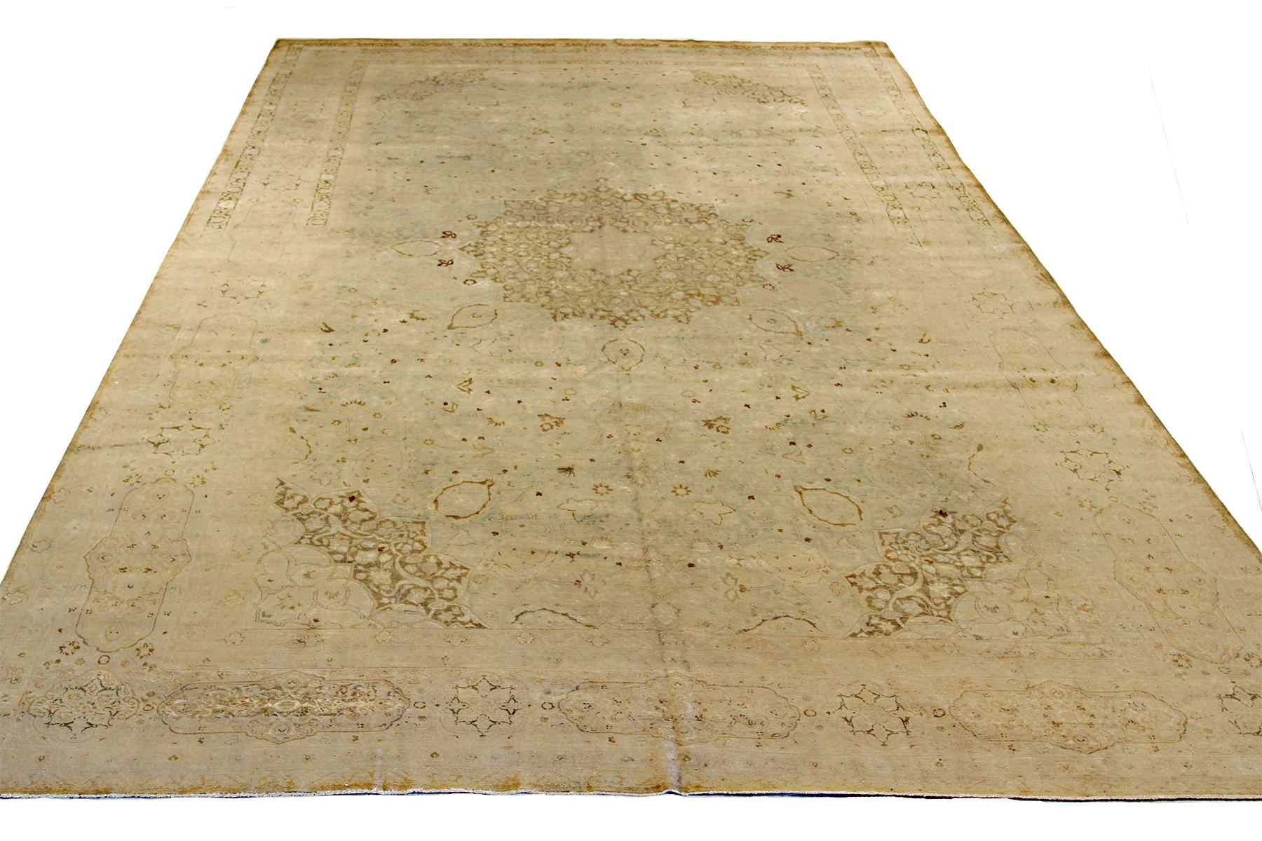 Antique Persian rug handwoven from the finest sheep’s wool and colored with all-natural vegetable dyes that are safe for humans and pets. It’s a traditional Tabriz weaving featuring an elegant ensemble of floral designs in brown with shades of gray