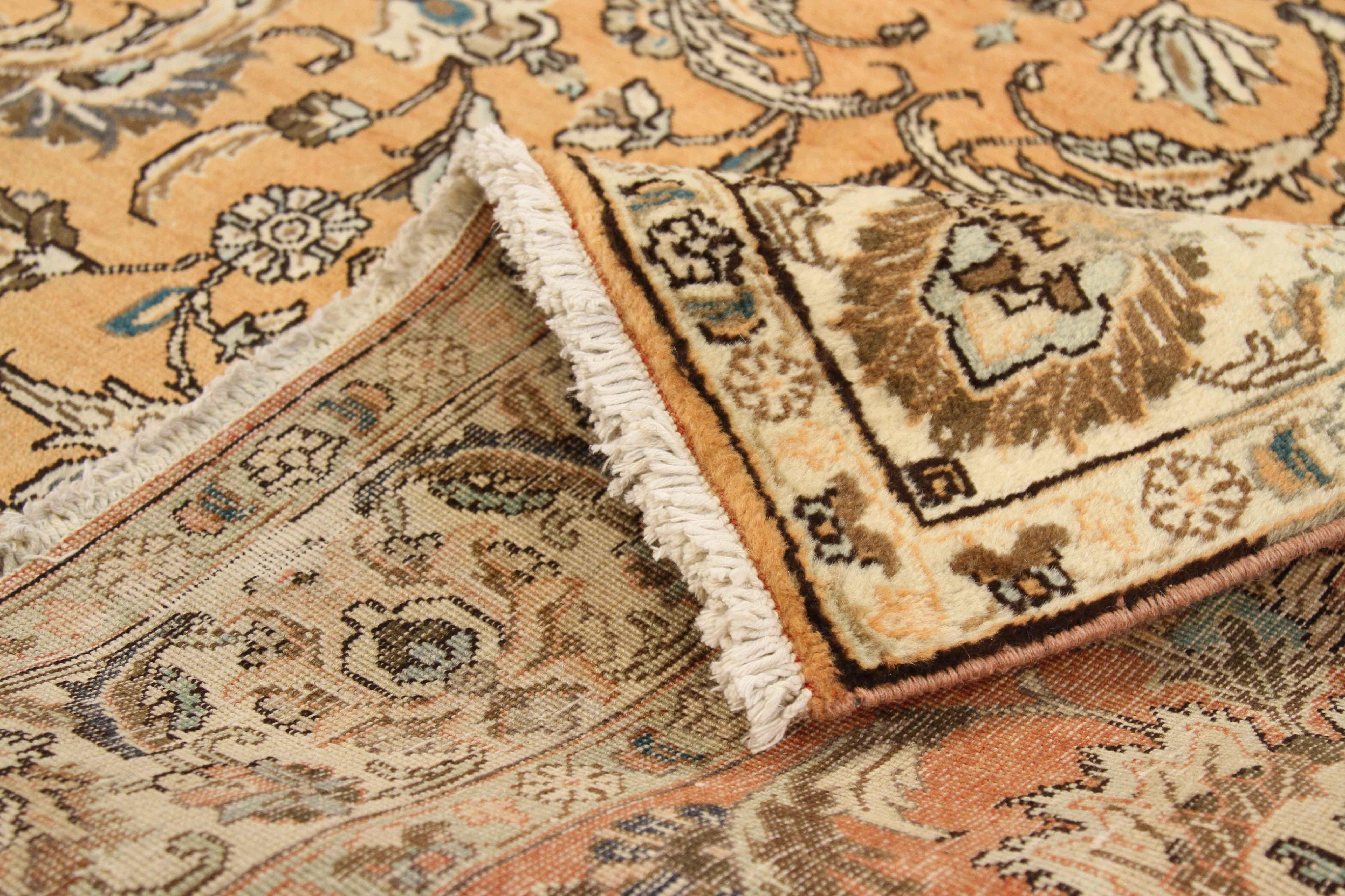 Antique Persian rug handwoven from the finest sheep’s wool and colored with all-natural vegetable dyes that are safe for humans and pets. It’s a traditional Tabriz weaving featuring a lovely ensemble of floral designs in brown and ivory over an