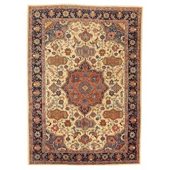 Tapis persan antique Tabriz avec médaillon central entouré de motifs floraux